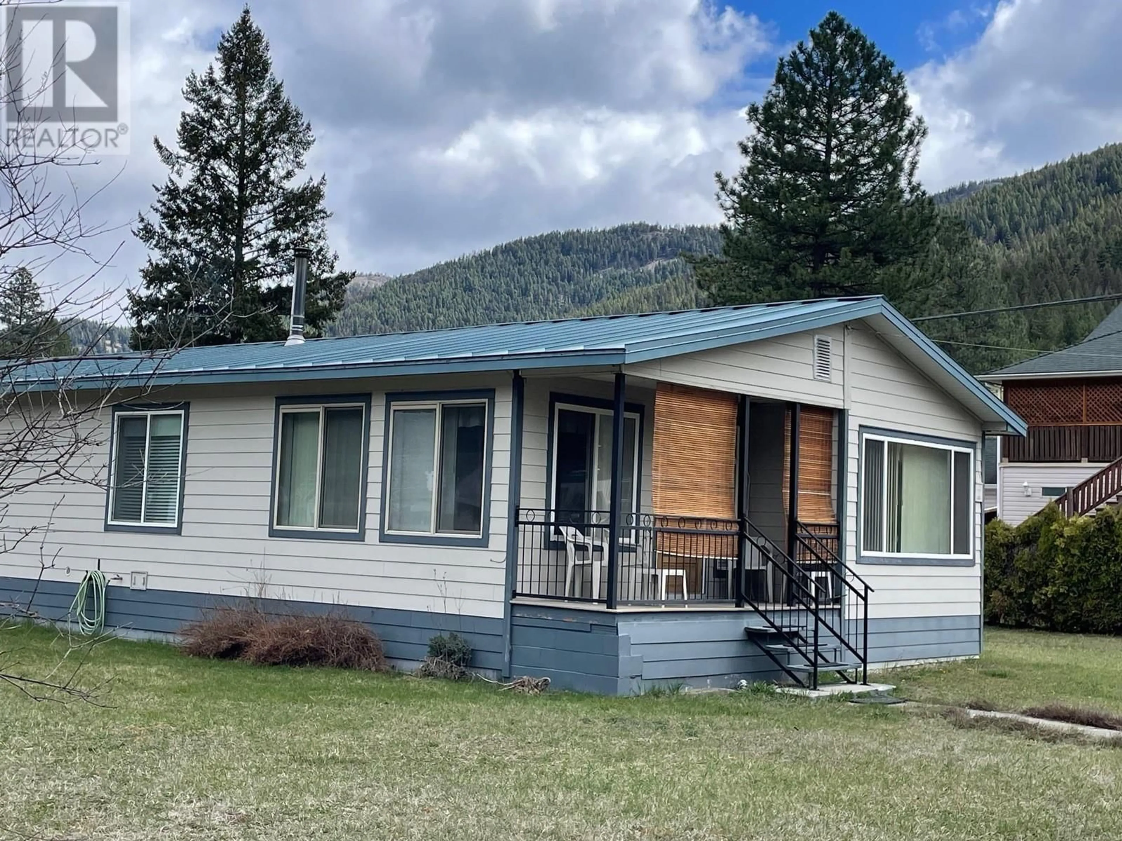 Home with vinyl exterior material, mountain view for 5834 3RD STREET, Beaverdell British Columbia V0H1A0