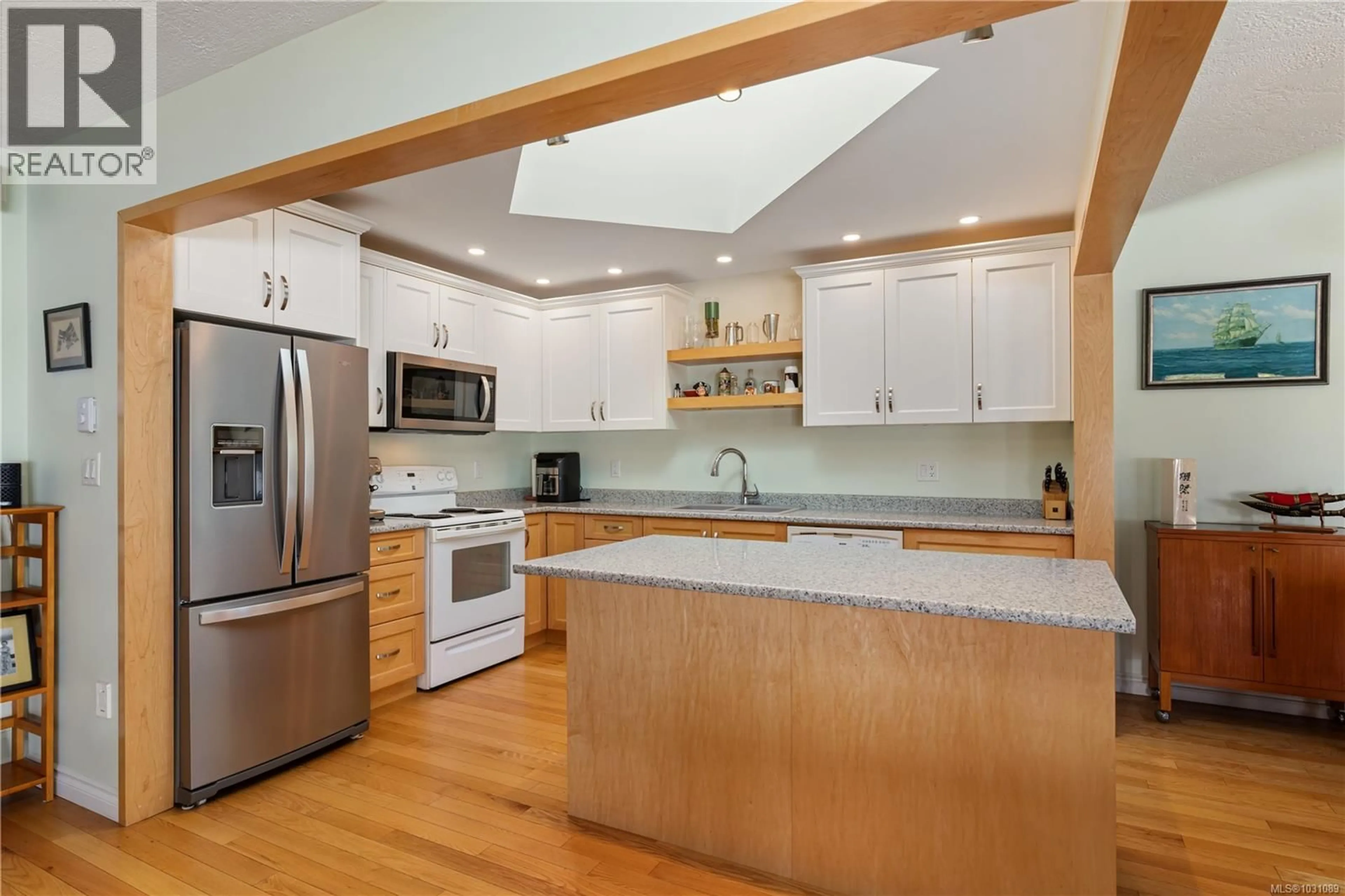 Open concept kitchen, wood/laminate floor for 15 - 1717 BLAIR AVENUE, Saanich British Columbia V8N6G6