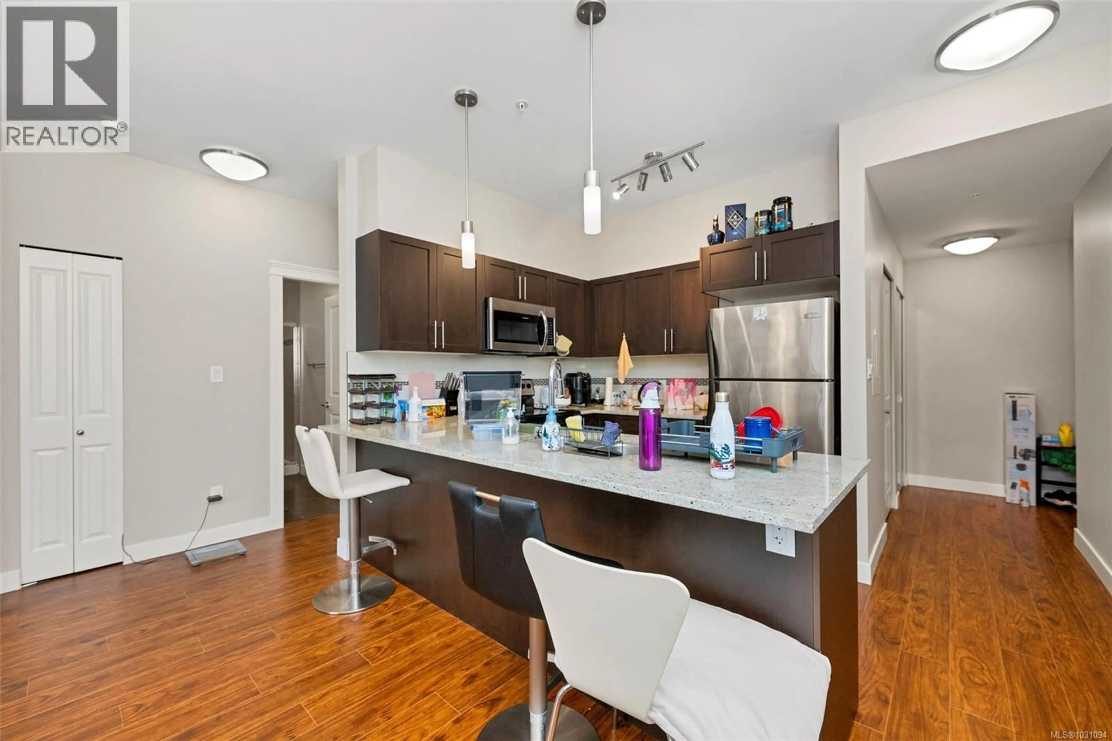 Open concept kitchen, wood/laminate floor for 203 - 844 GOLDSTREAM AVENUE, Langford British Columbia V9B2X7