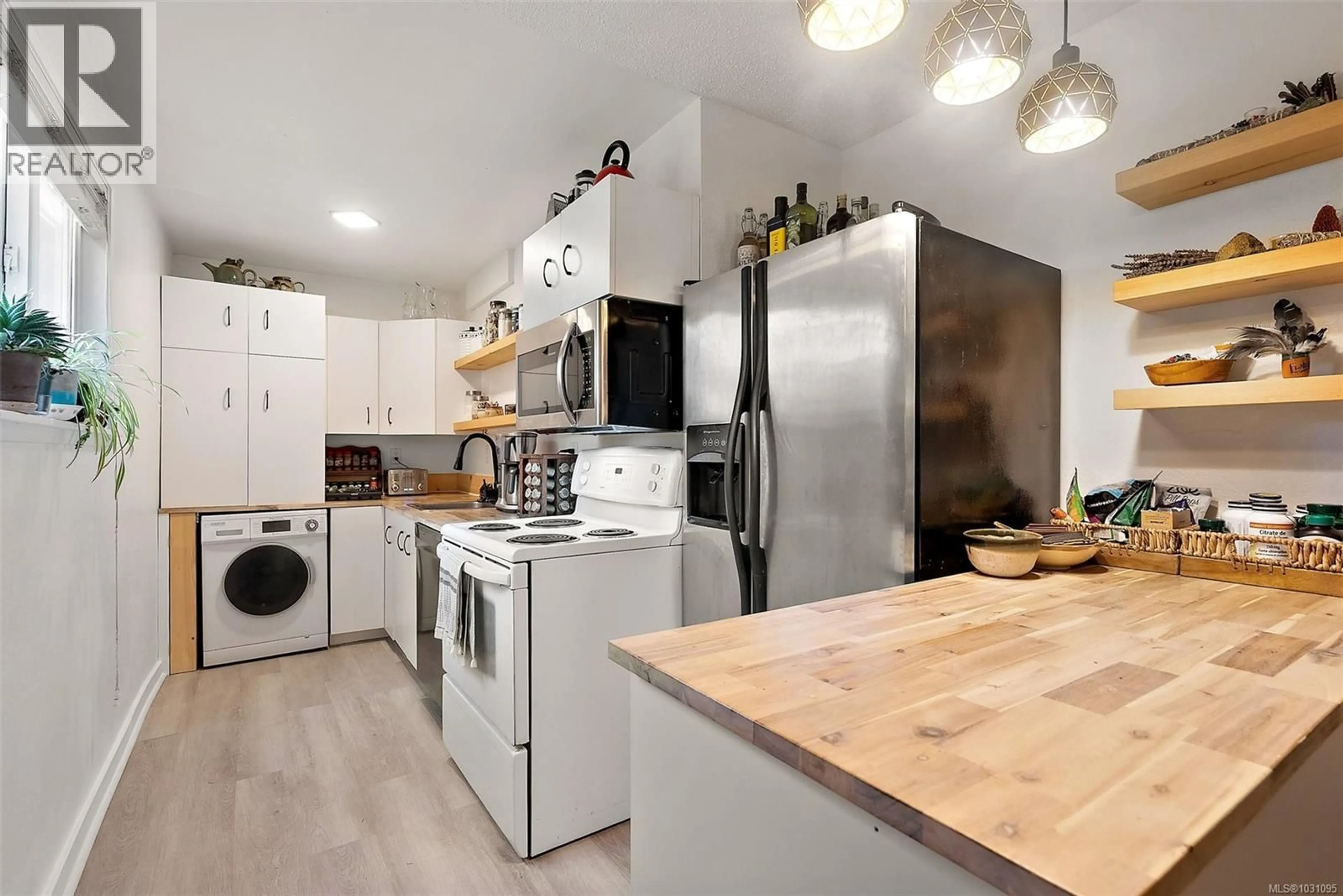 Open concept kitchen, wood/laminate floor for 105 - 1987 KALTASIN ROAD, Sooke British Columbia V9Z0B6