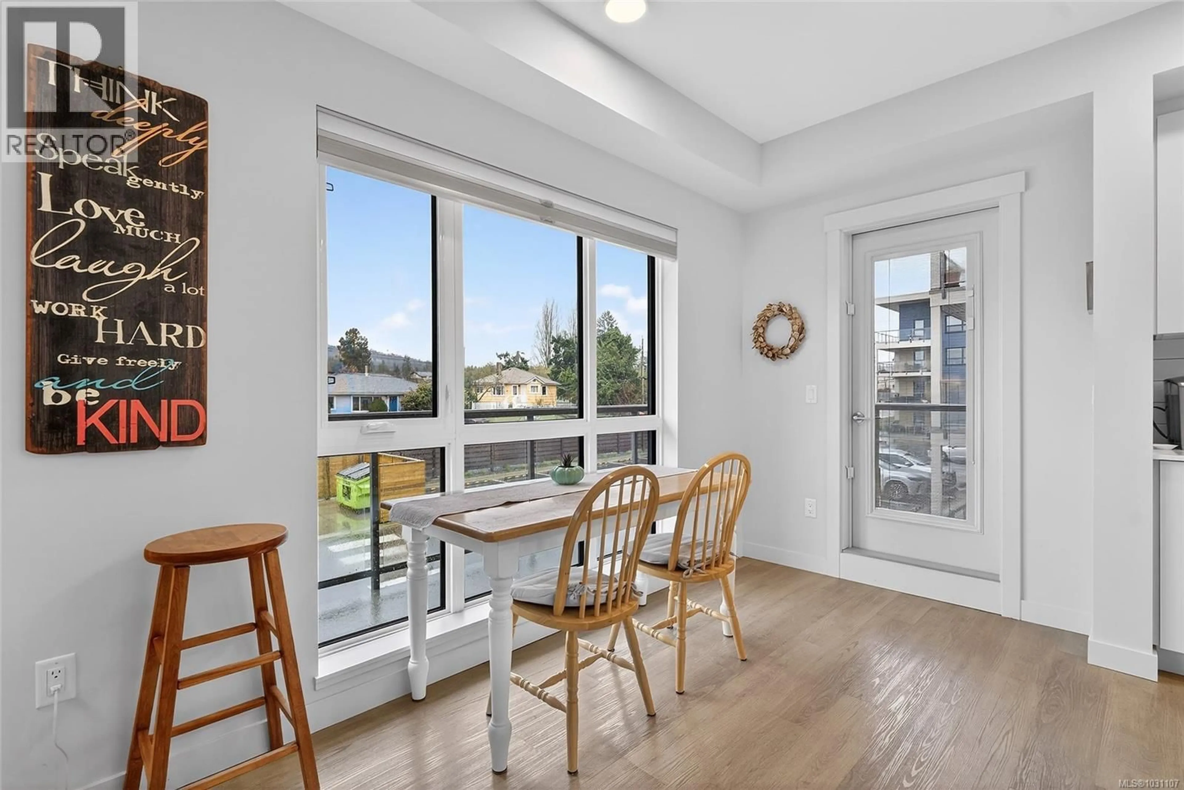 Dining room, wood/laminate floor for 202 - 120 JENSEN AVENUE EAST, Parksville British Columbia V9P0H6