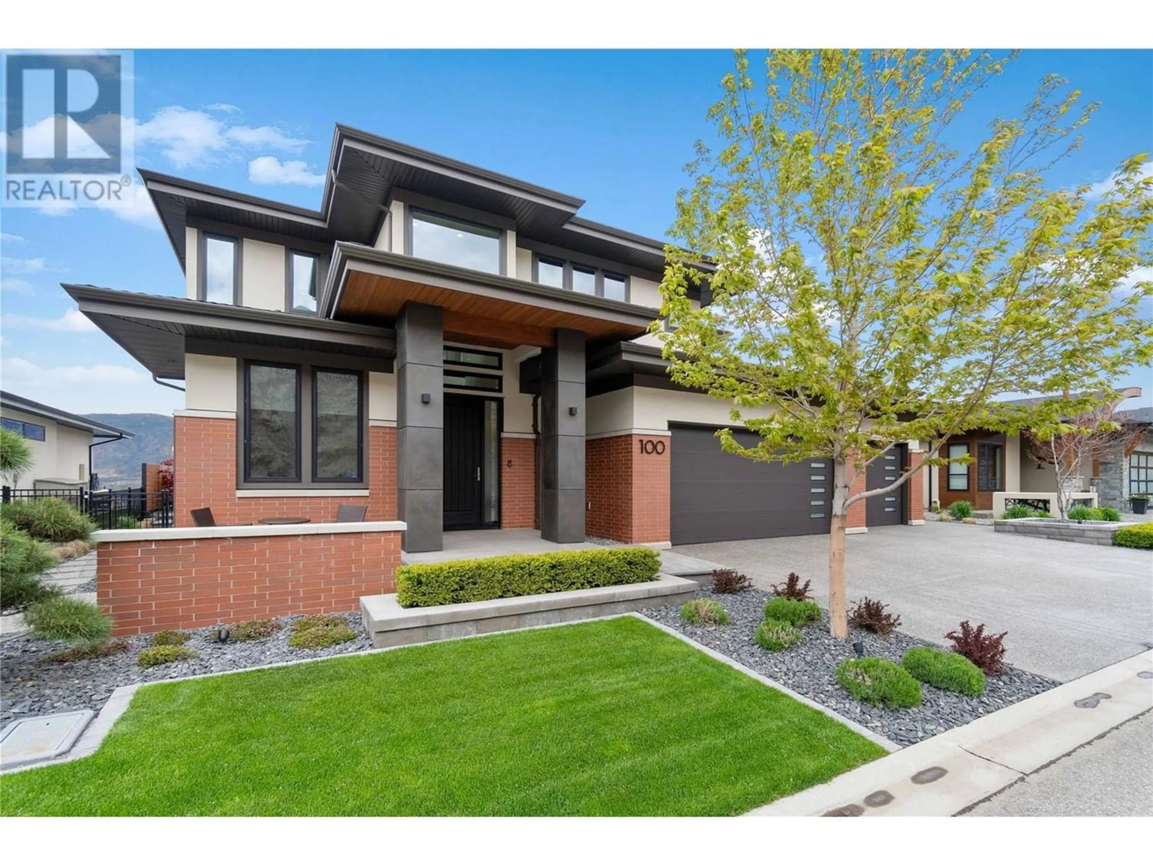 Home with brick exterior material for 100 Red Sky Place, Kelowna British Columbia V1V3E3