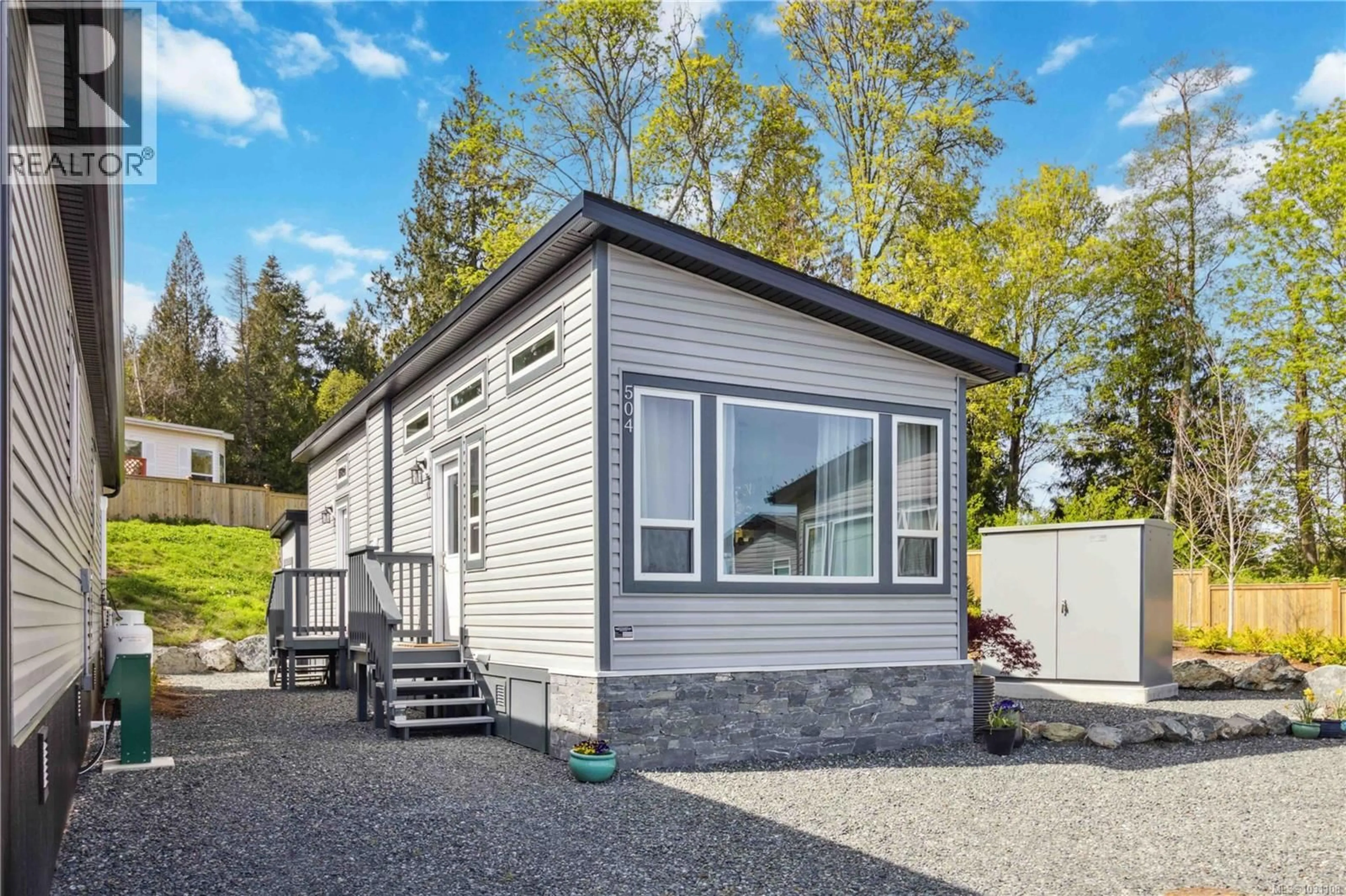 Home with vinyl exterior material, street for 504 - 747 OLD PLACE ROAD, Central Saanich British Columbia V8M0C3