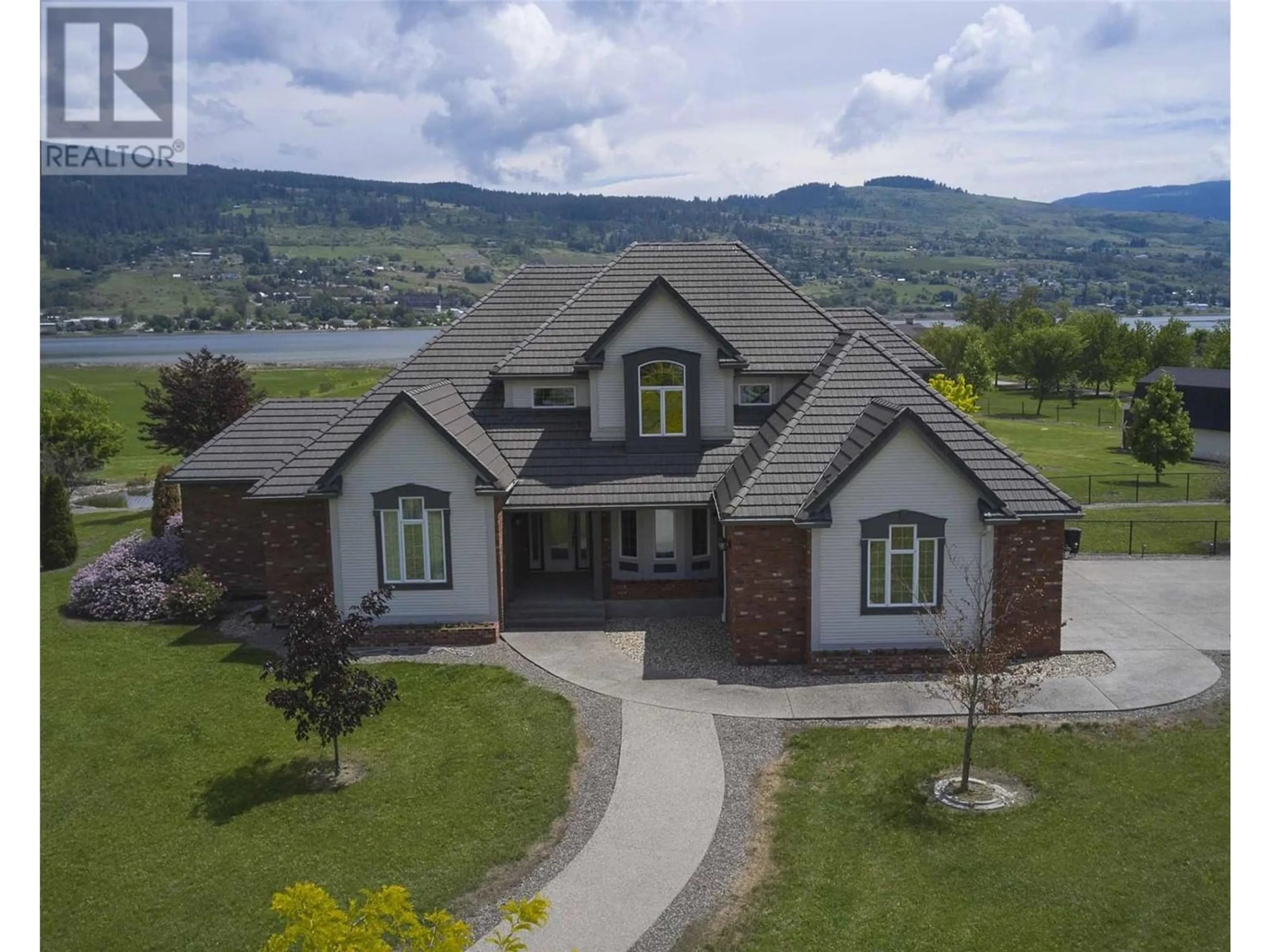 Frontside or backside of a home for 8163 Old Kamloops Road, Vernon British Columbia V1H1W8