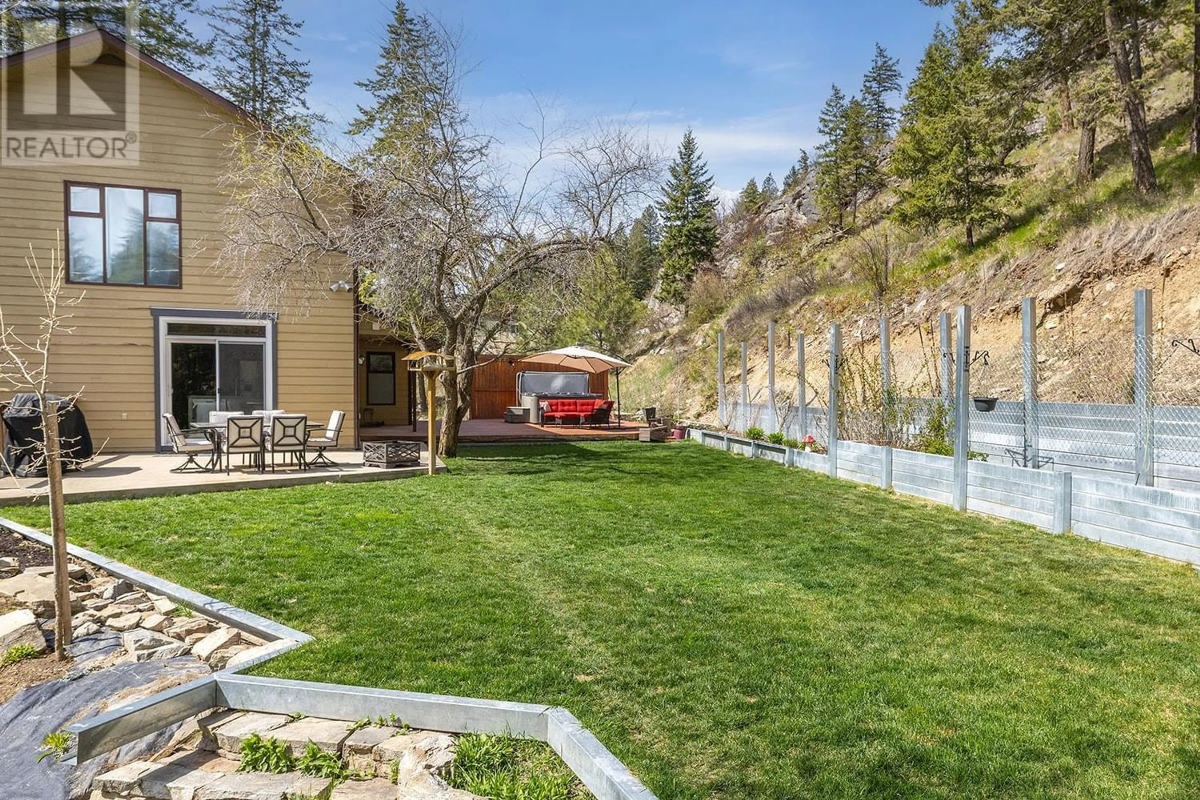 Patio, the fenced backyard for 6750 Highway 33 E, Kelowna British Columbia V1P1H9