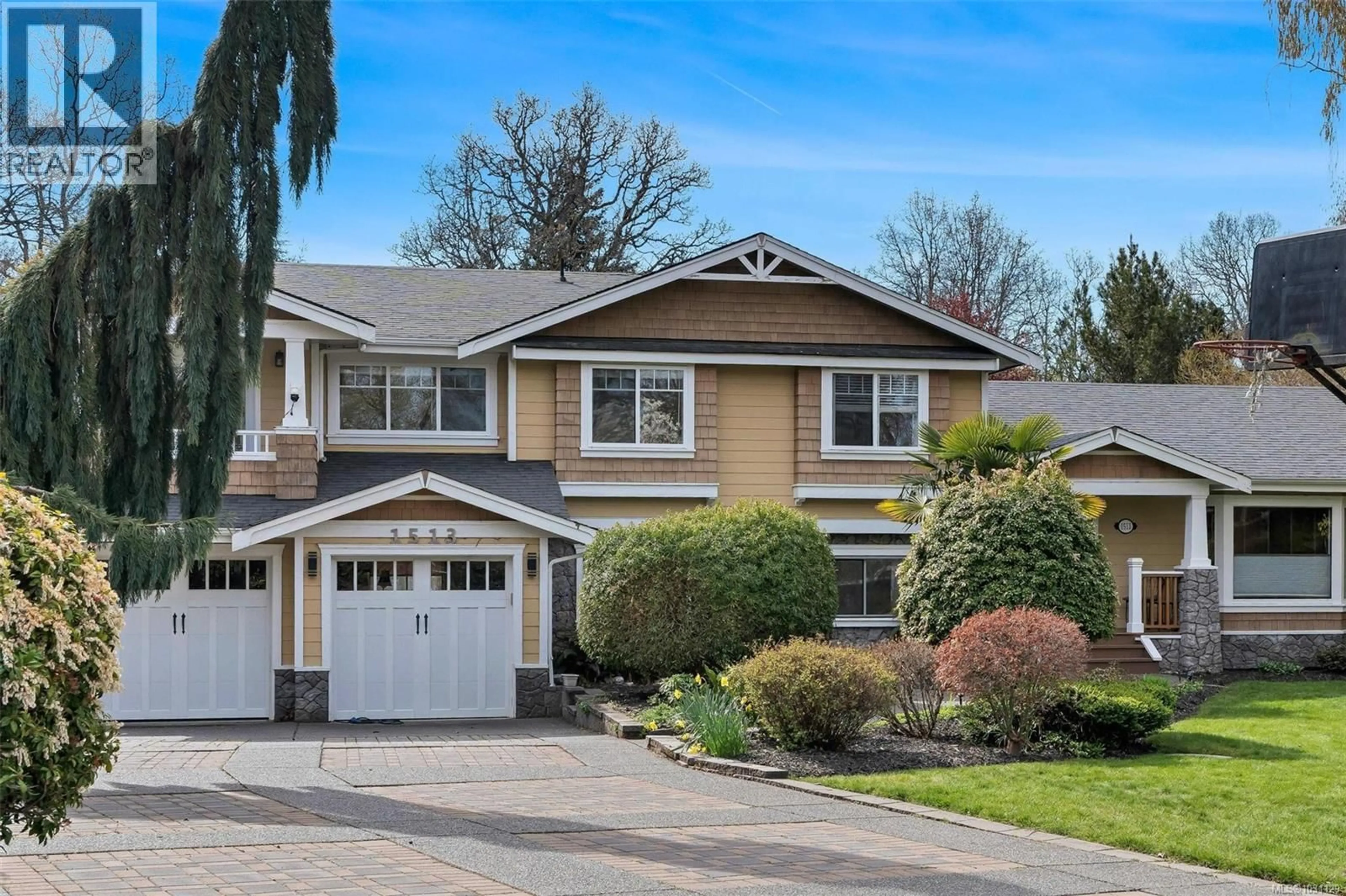 Home with vinyl exterior material, street for 1513 ERIC ROAD, Saanich British Columbia V8N5Y6