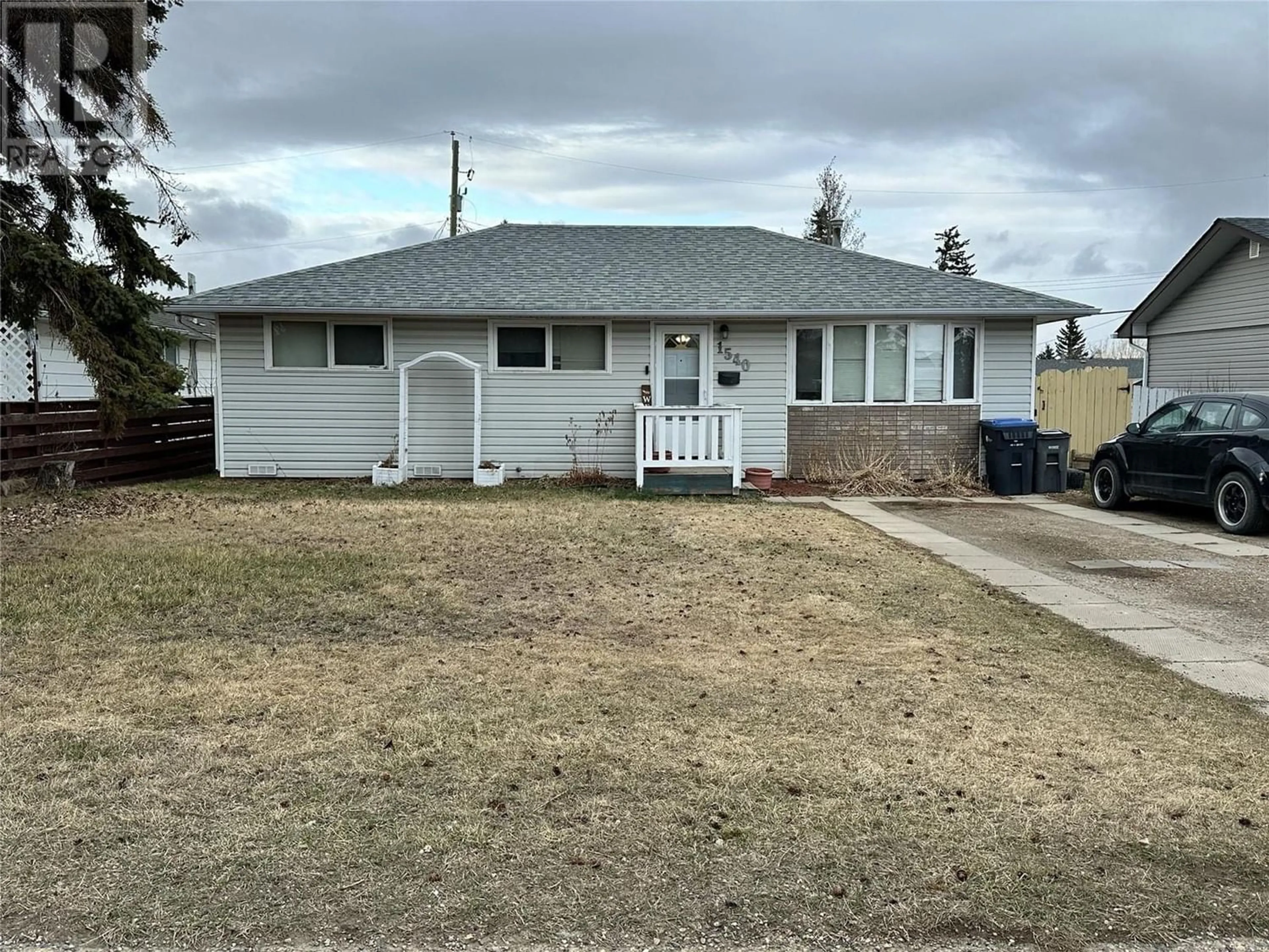 Frontside or backside of a home for 1540 115 Avenue, Dawson Creek British Columbia V1G3C5