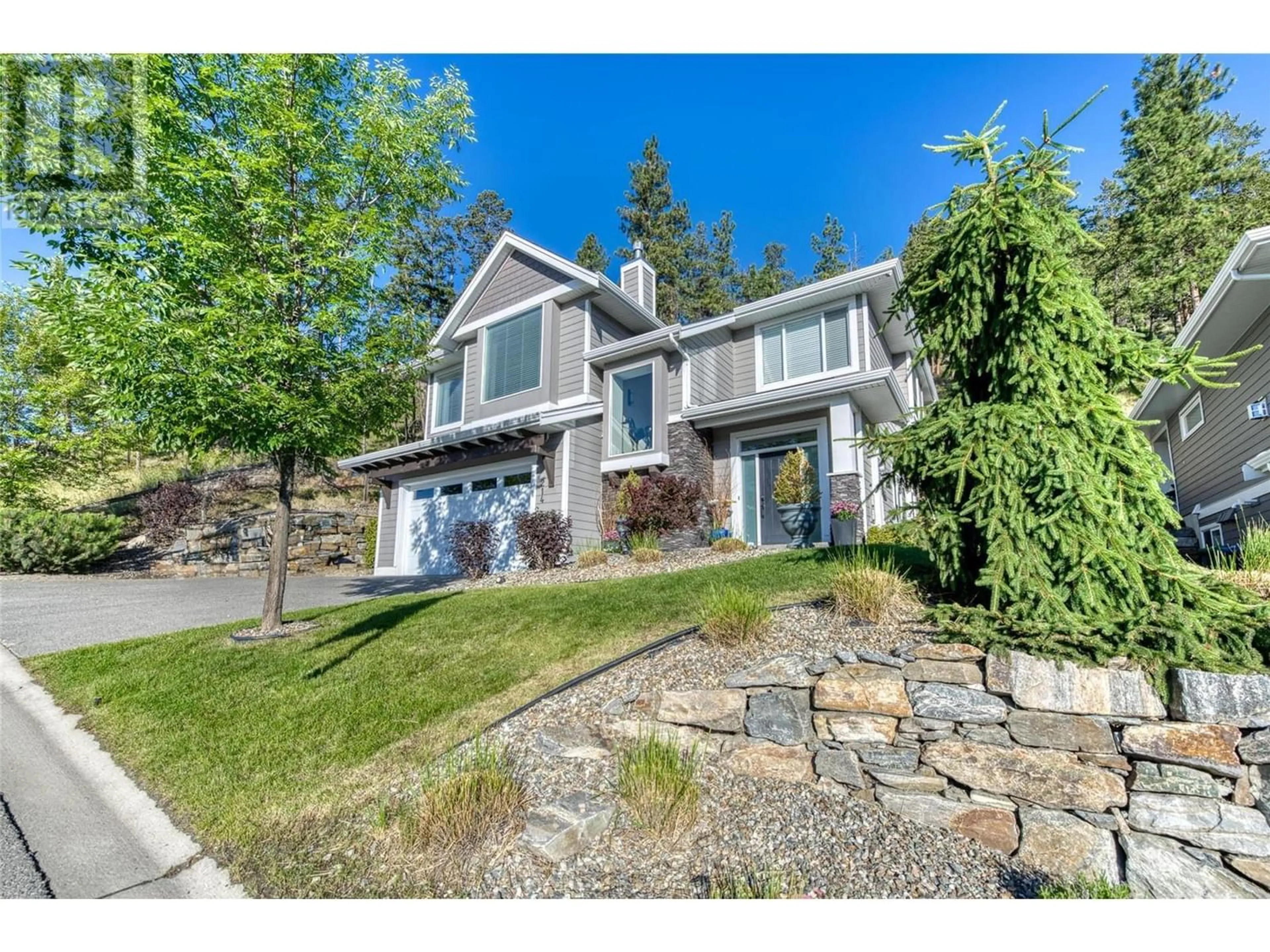 Frontside or backside of a home for 214 Upper Canyon Drive N, Kelowna British Columbia V1V3C7