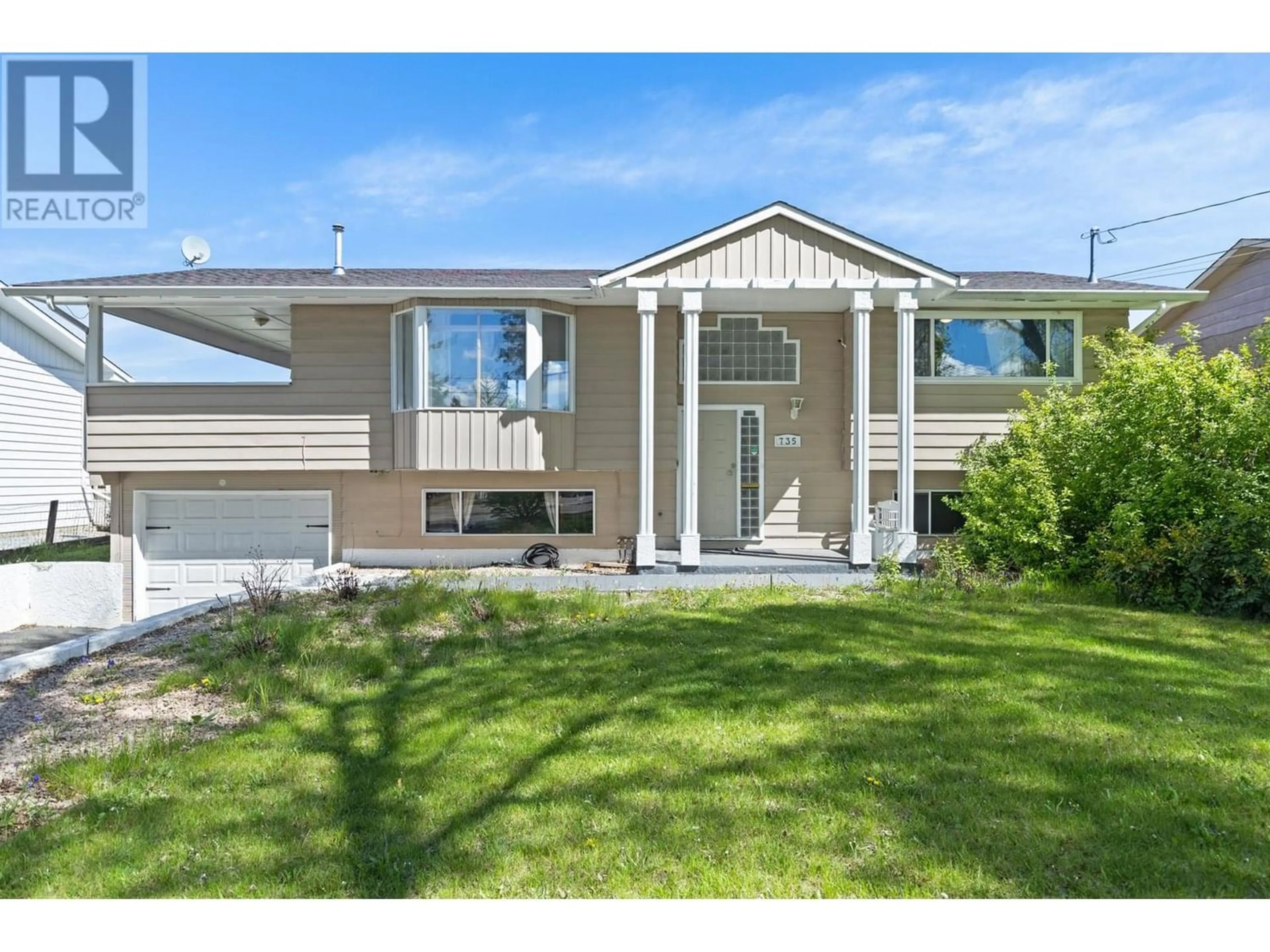 Frontside or backside of a home for 735 Mitchell Road, Kelowna British Columbia V1X3W4
