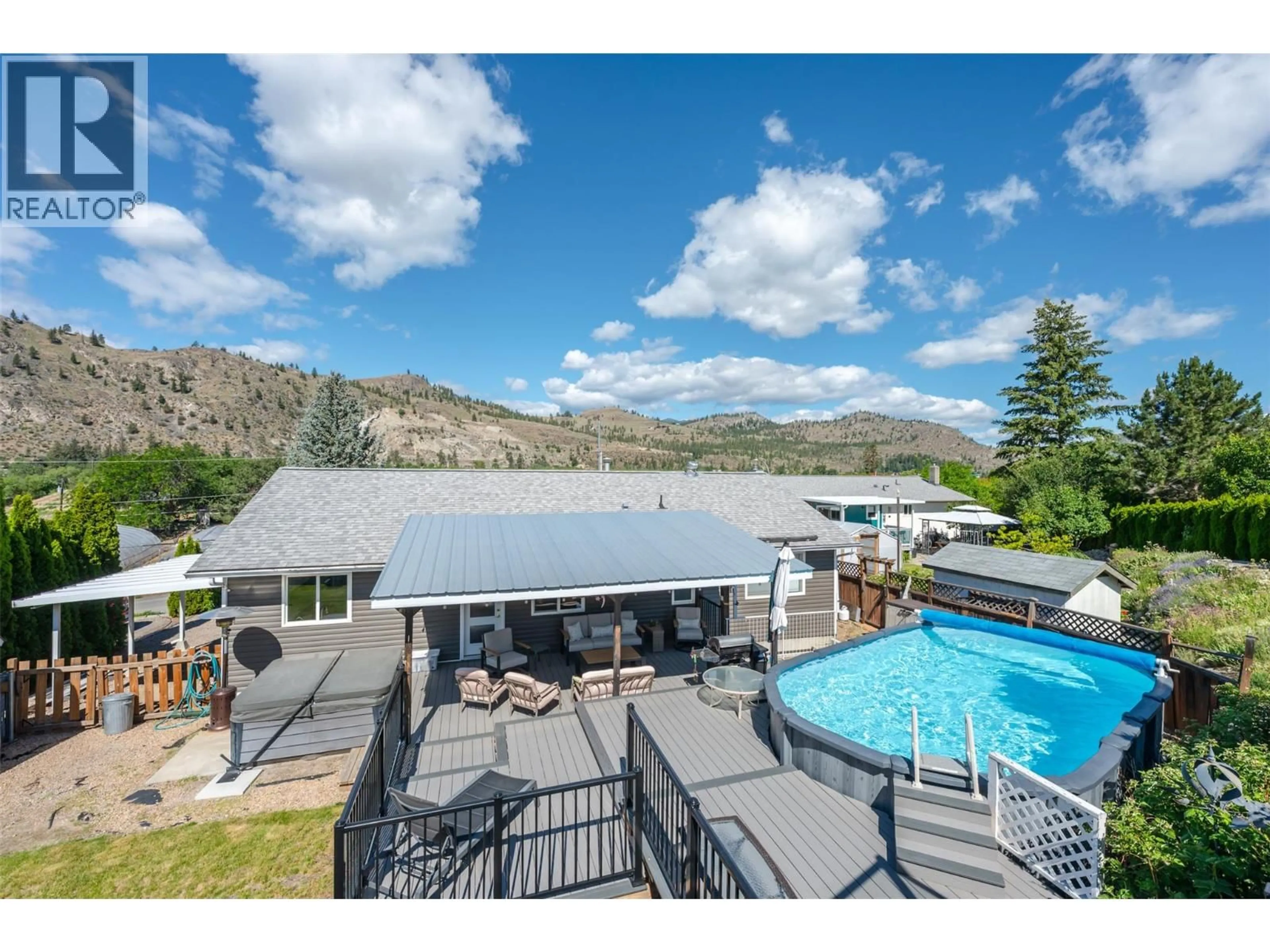 A pic from outside/outdoor area/front of a property/back of a property/a pic from drone, mountain view for 6763 MEADOWS DRIVE, Oliver British Columbia V0H1T4