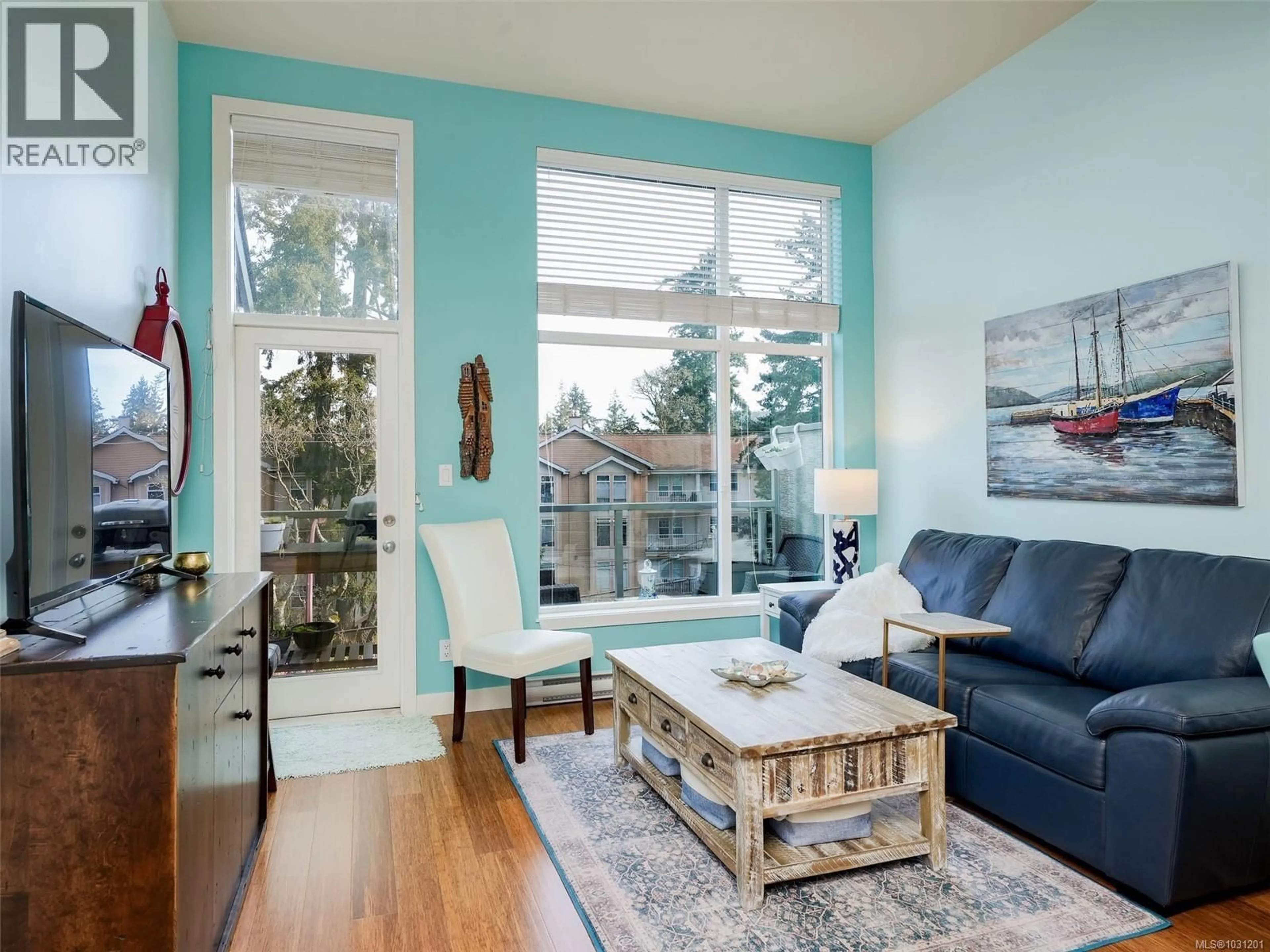 Living room with furniture, wood/laminate floor for 408 - 611 GOLDSTREAM AVENUE, Langford British Columbia V9B2W9