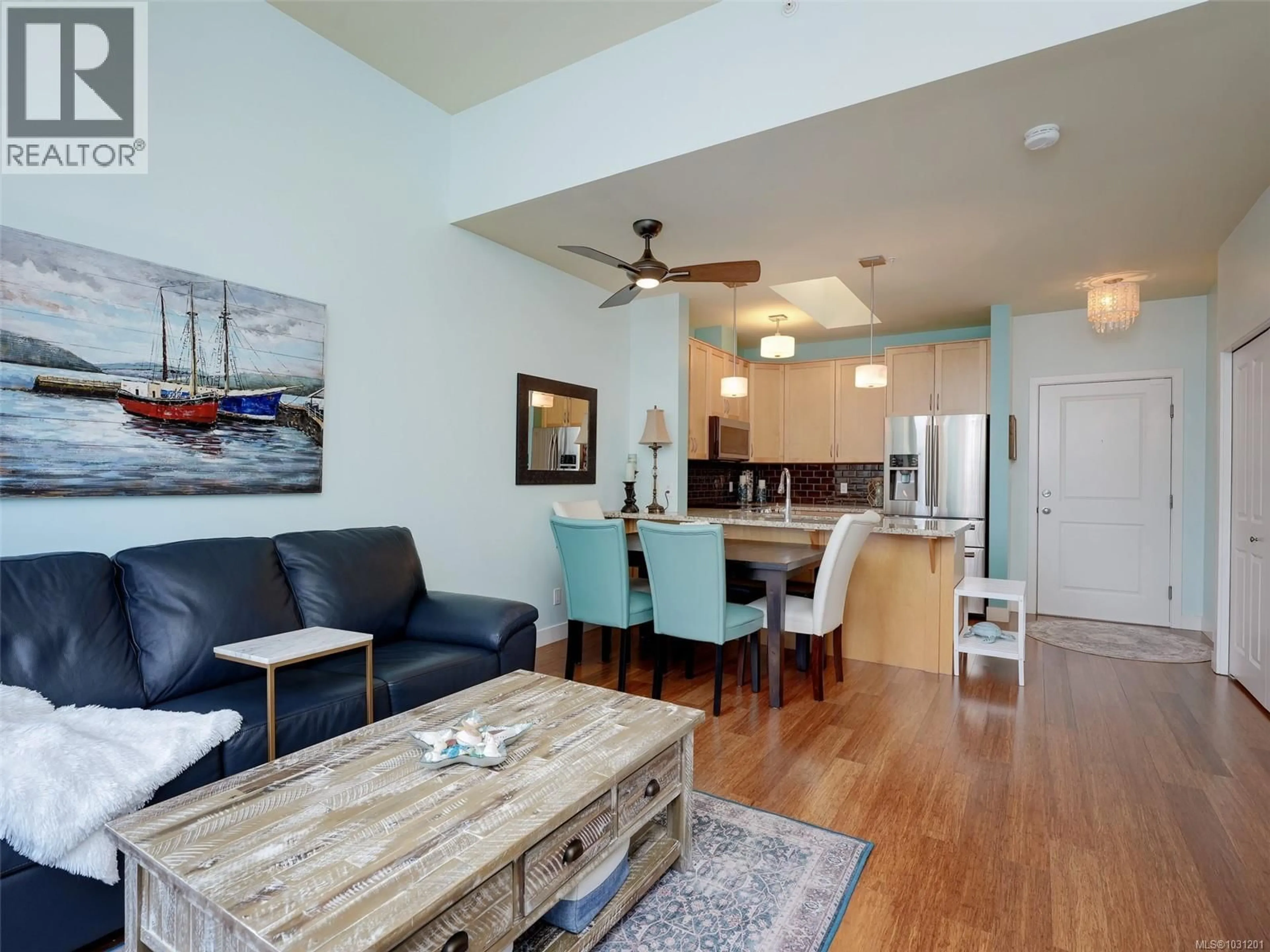 Living room with furniture, wood/laminate floor for 408 - 611 GOLDSTREAM AVENUE, Langford British Columbia V9B2W9