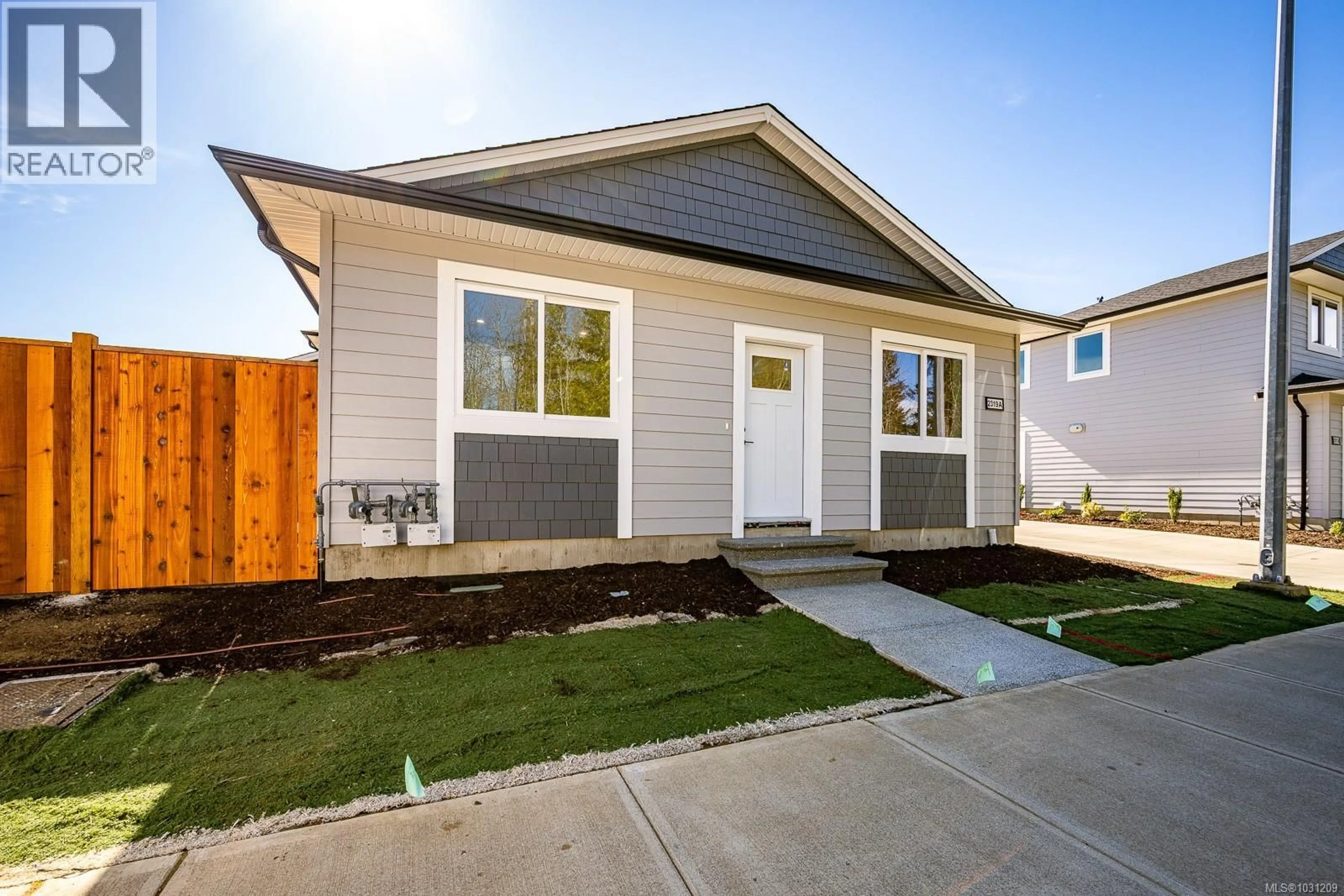 Home with vinyl exterior material, street for A - 2319 MCDONALD ROAD, Comox British Columbia V9M0C8