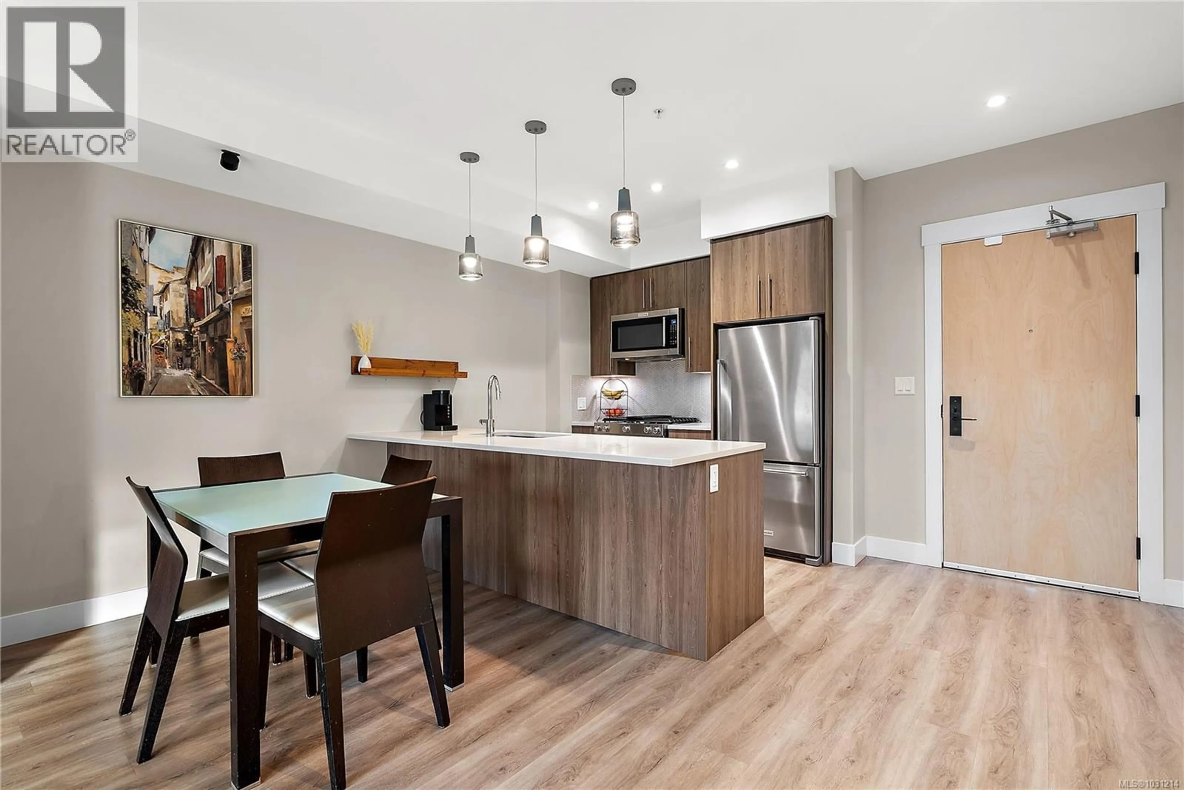 Open concept kitchen, wood/laminate floor for 402 - 2500 HACKETT CRESCENT, Central Saanich British Columbia V8M0C1