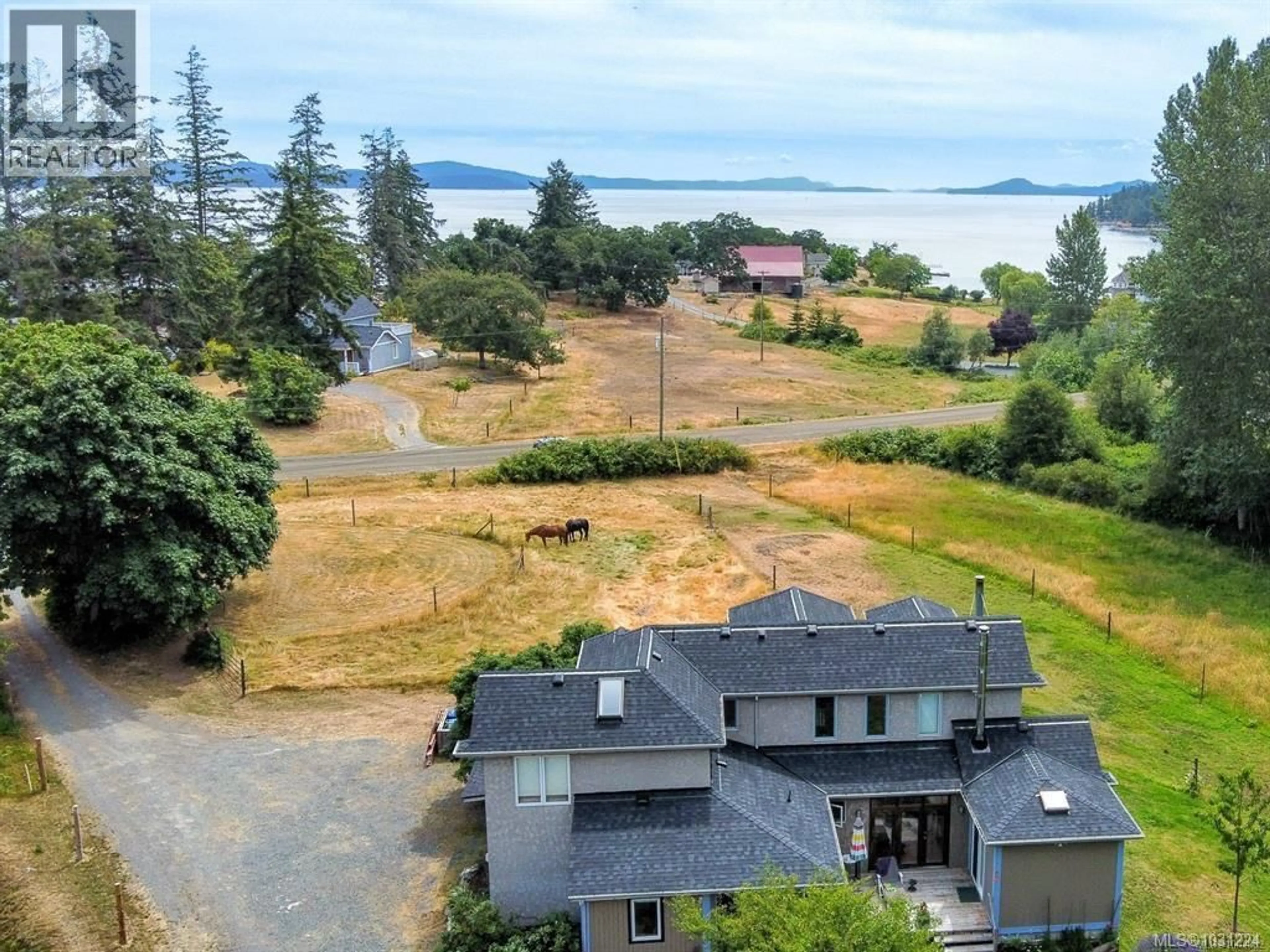 A pic from outside/outdoor area/front of a property/back of a property/a pic from drone, water/lake/river/ocean view for 2035 PACE ROAD, Nanaimo British Columbia V9X1N8