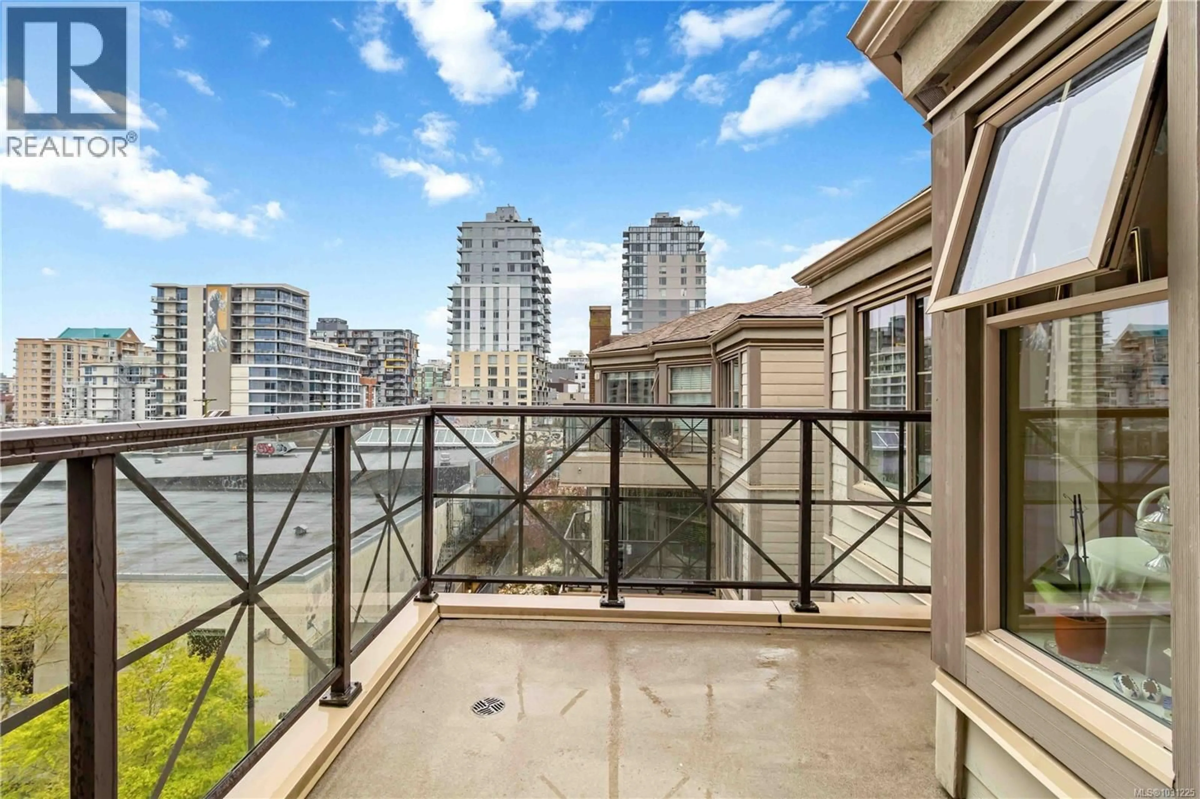 Balcony in the apartment, city buildings view from balcony for 406 - 935 JOHNSON STREET, Victoria British Columbia V8V3N5
