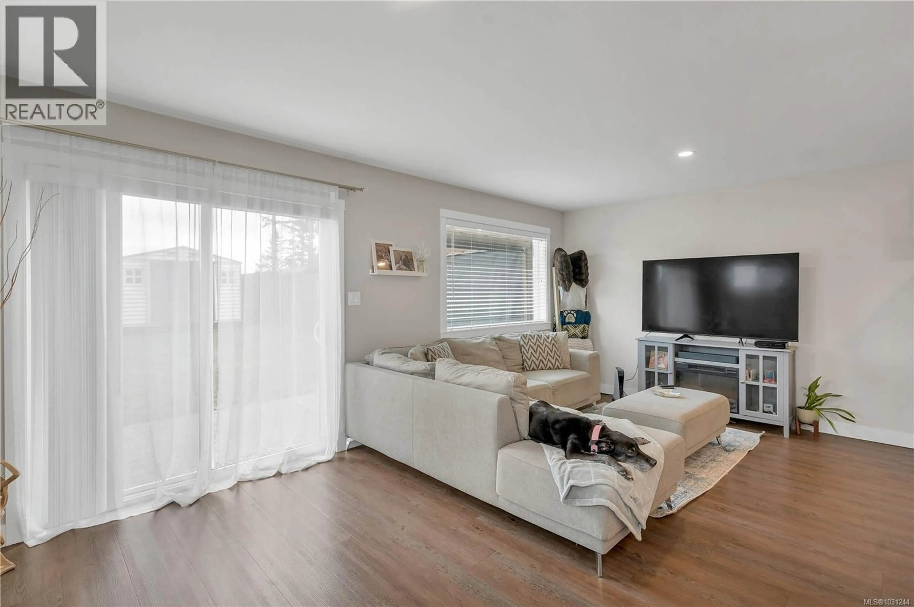 Living room with furniture, wood/laminate floor for A - 535 PETERSEN ROAD, Campbell River British Columbia V9W3H6