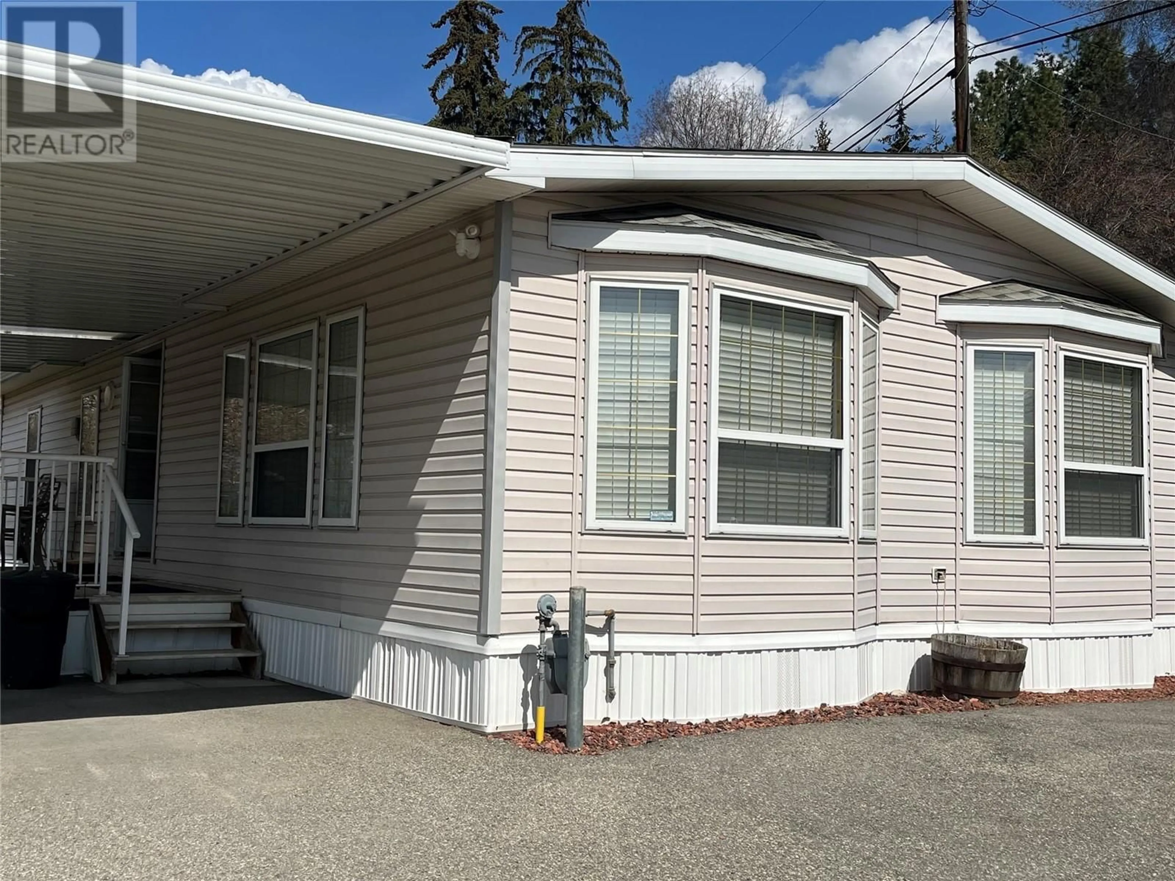Home with vinyl exterior material for 7611 Pleasant Valley Road, Vernon British Columbia V1B3R7