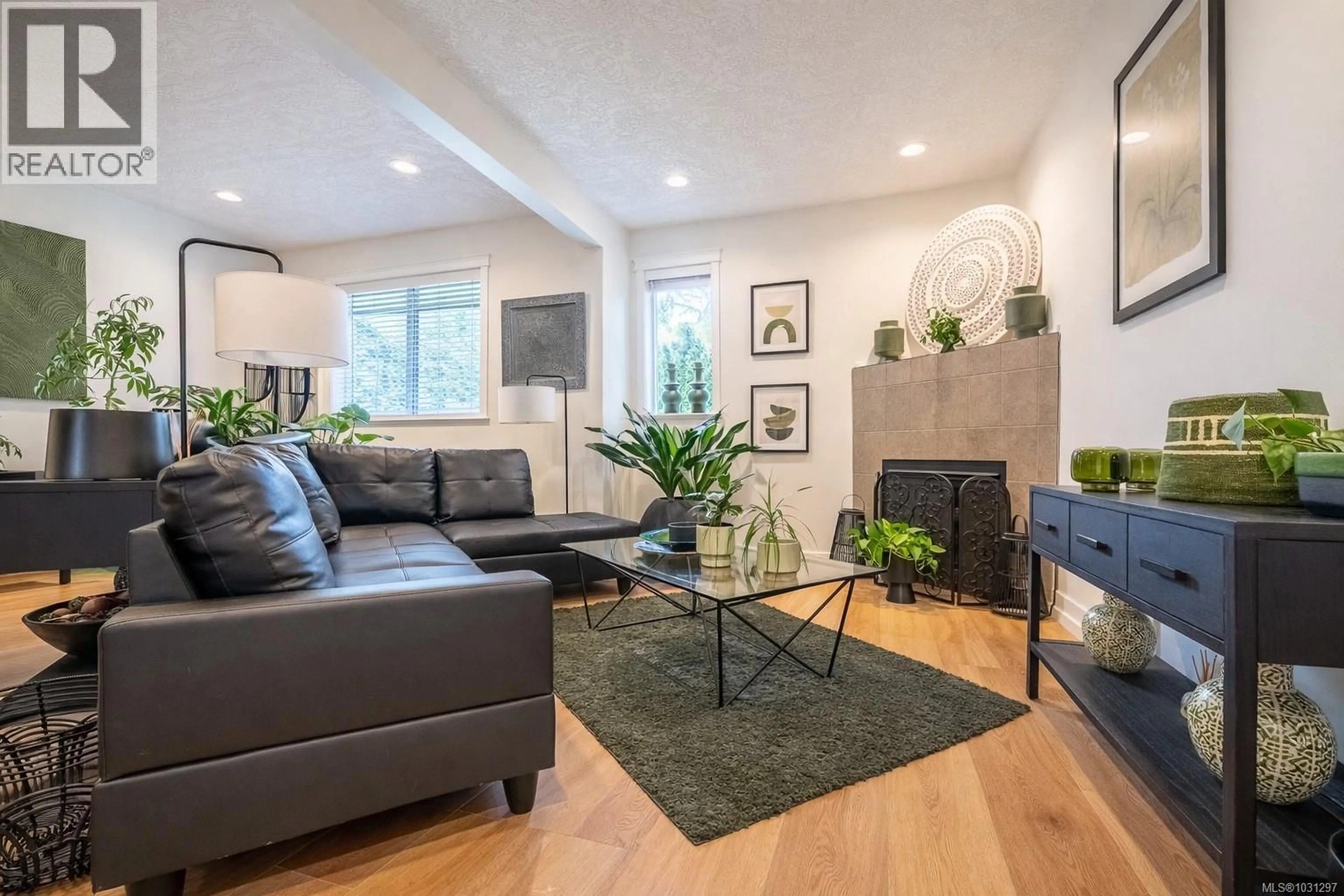 Living room with furniture, wood/laminate floor for 107 - 1924 MAPLE AVENUE SOUTH, Sooke British Columbia V9Z1J8