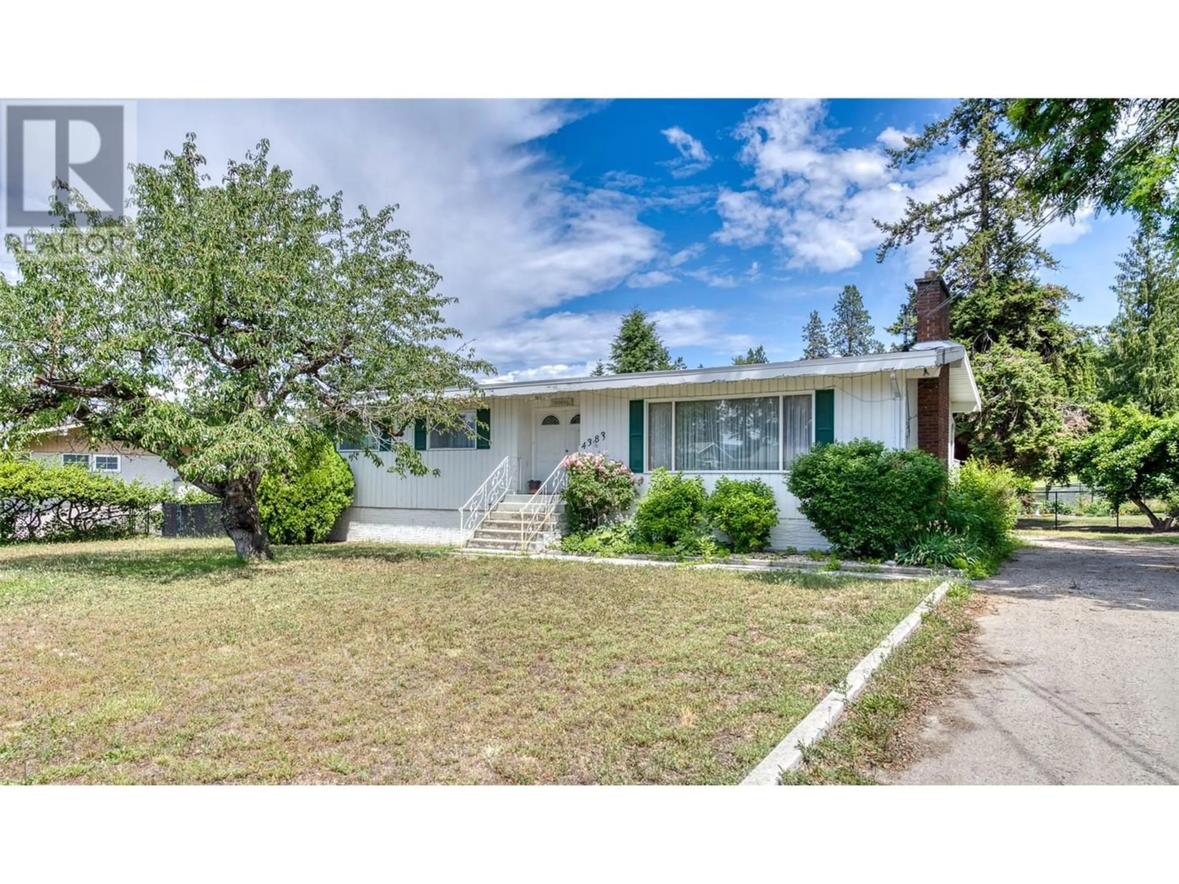 Frontside or backside of a home for 4383 Gordon Drive, Kelowna British Columbia V1W1S7