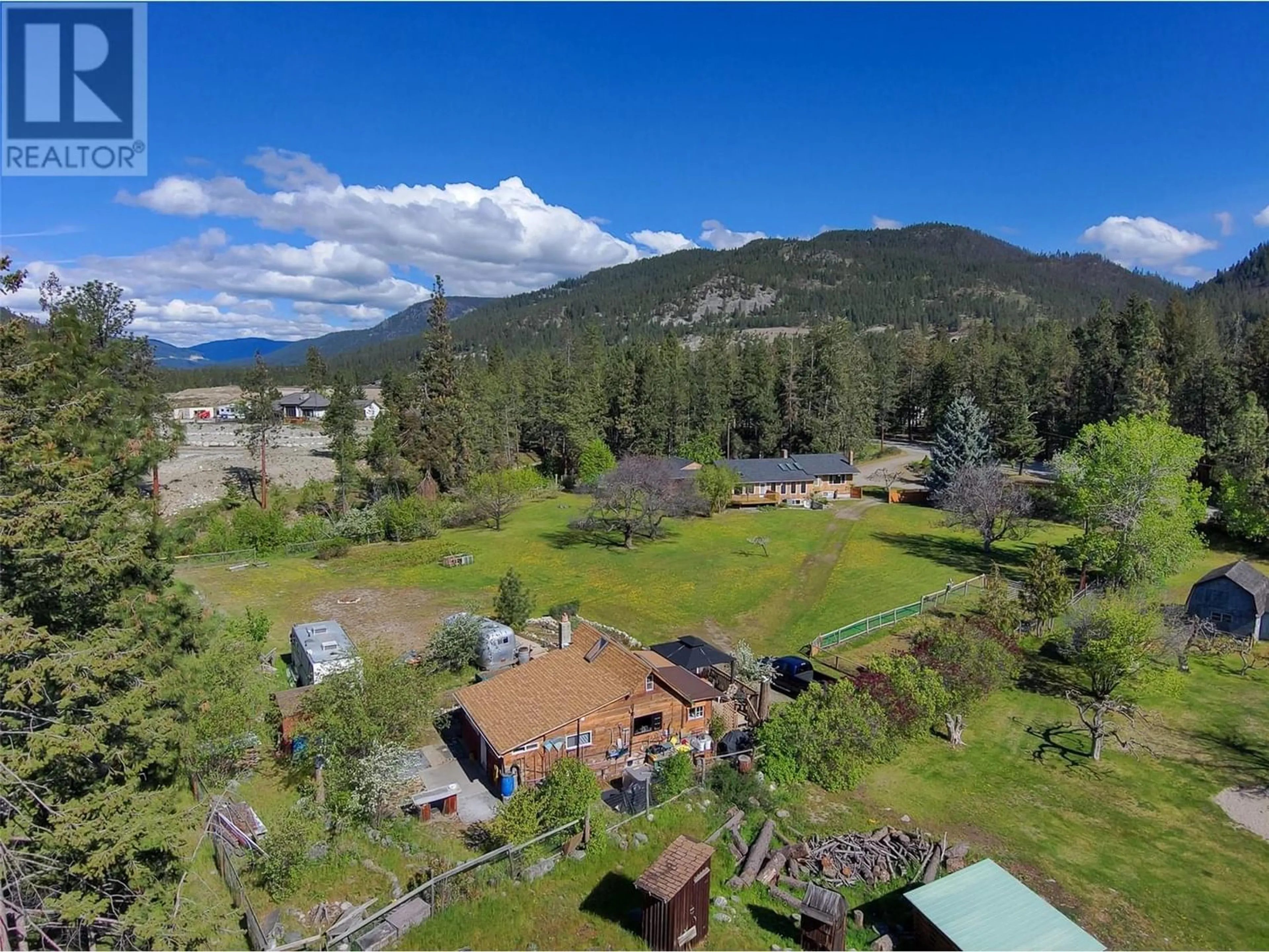 A pic from exterior of the house or condo, the fenced backyard for 5156 Mackinnon Road, Peachland British Columbia V0H1X2