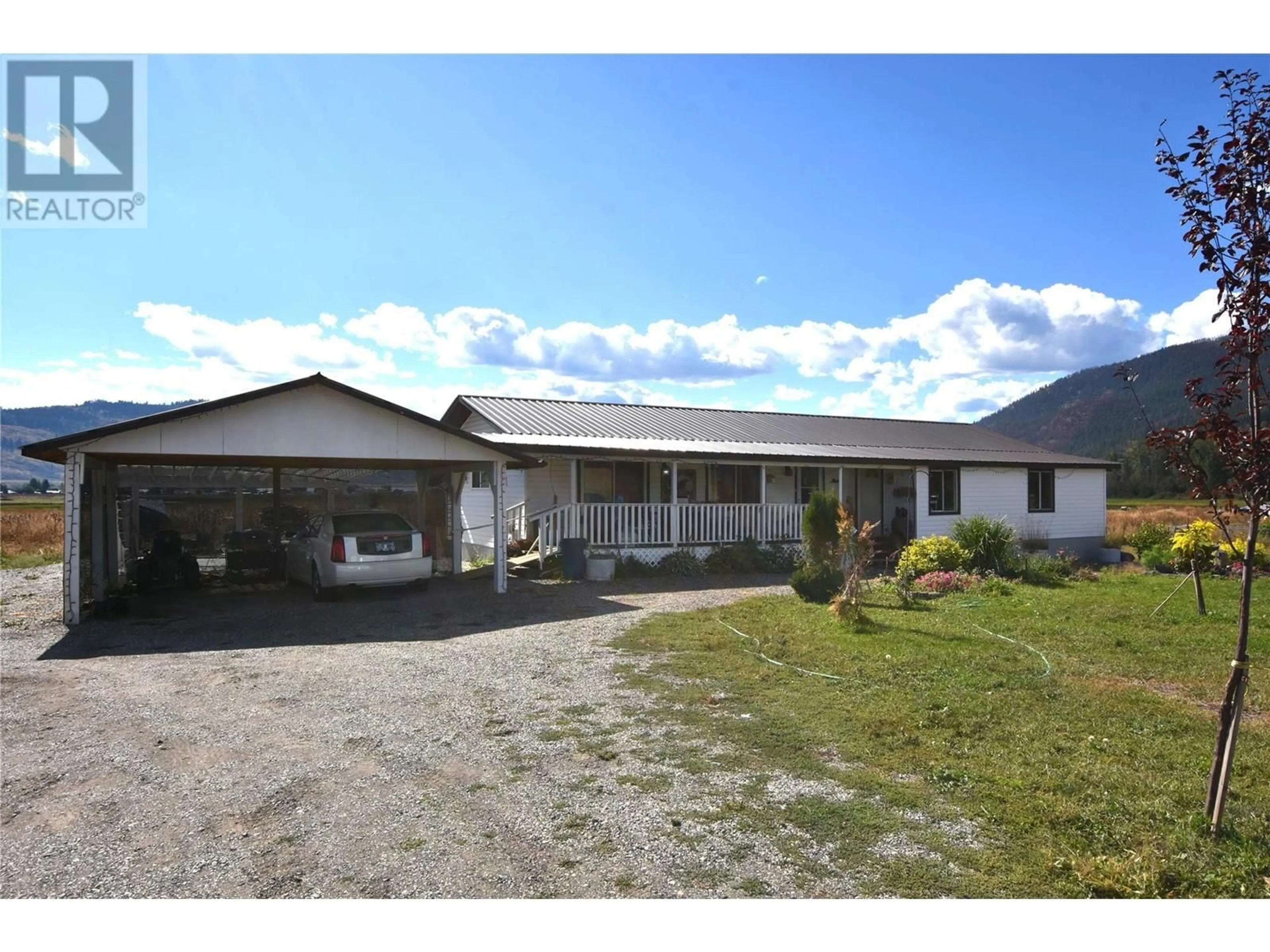 A pic from outside/outdoor area/front of a property/back of a property/a pic from drone, building for 12477 WESTSIDE ROAD, Vernon British Columbia V1H1Z3