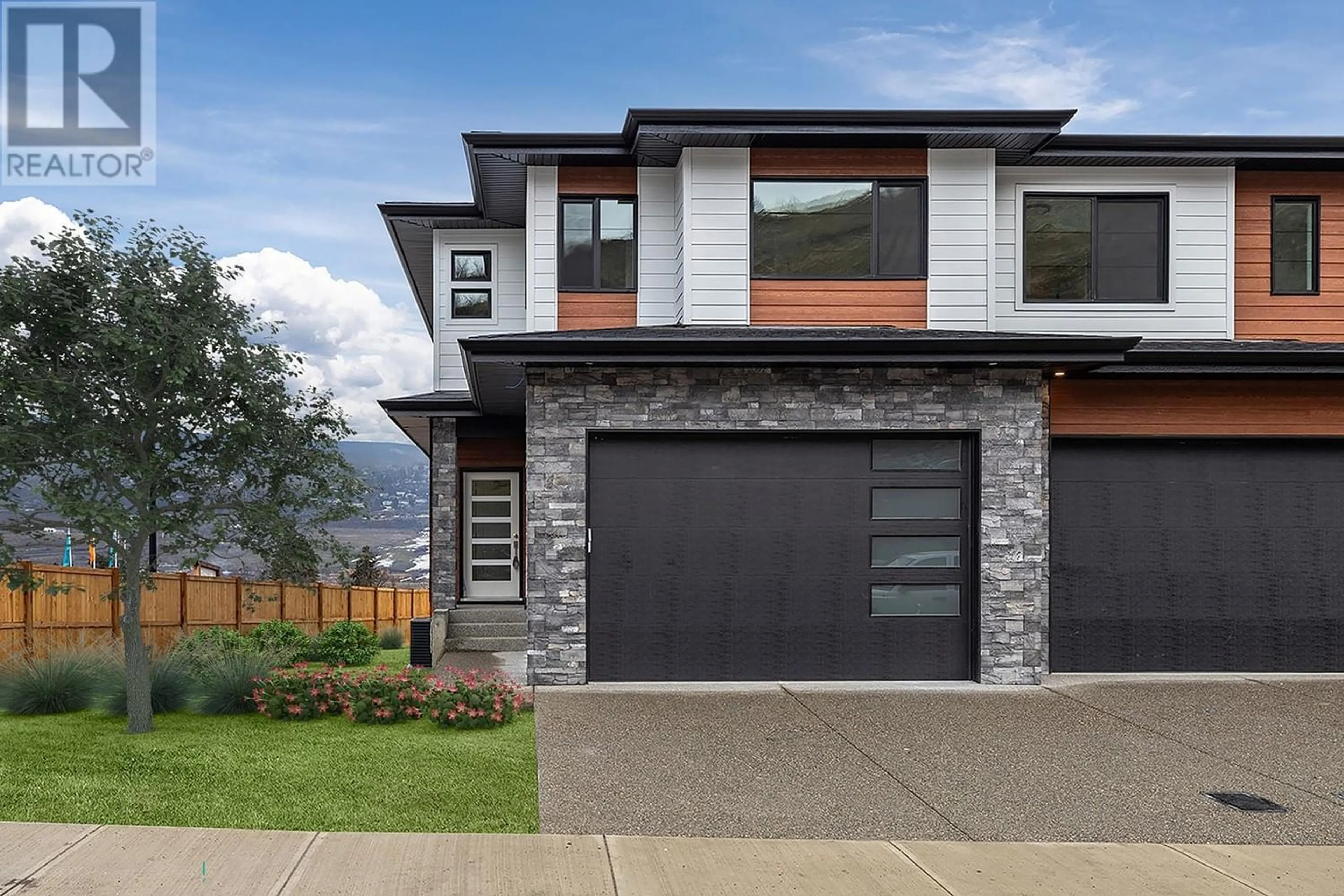 Home with brick exterior material for 305 Arrowleaf Rise, Coldstream British Columbia V1B1W2