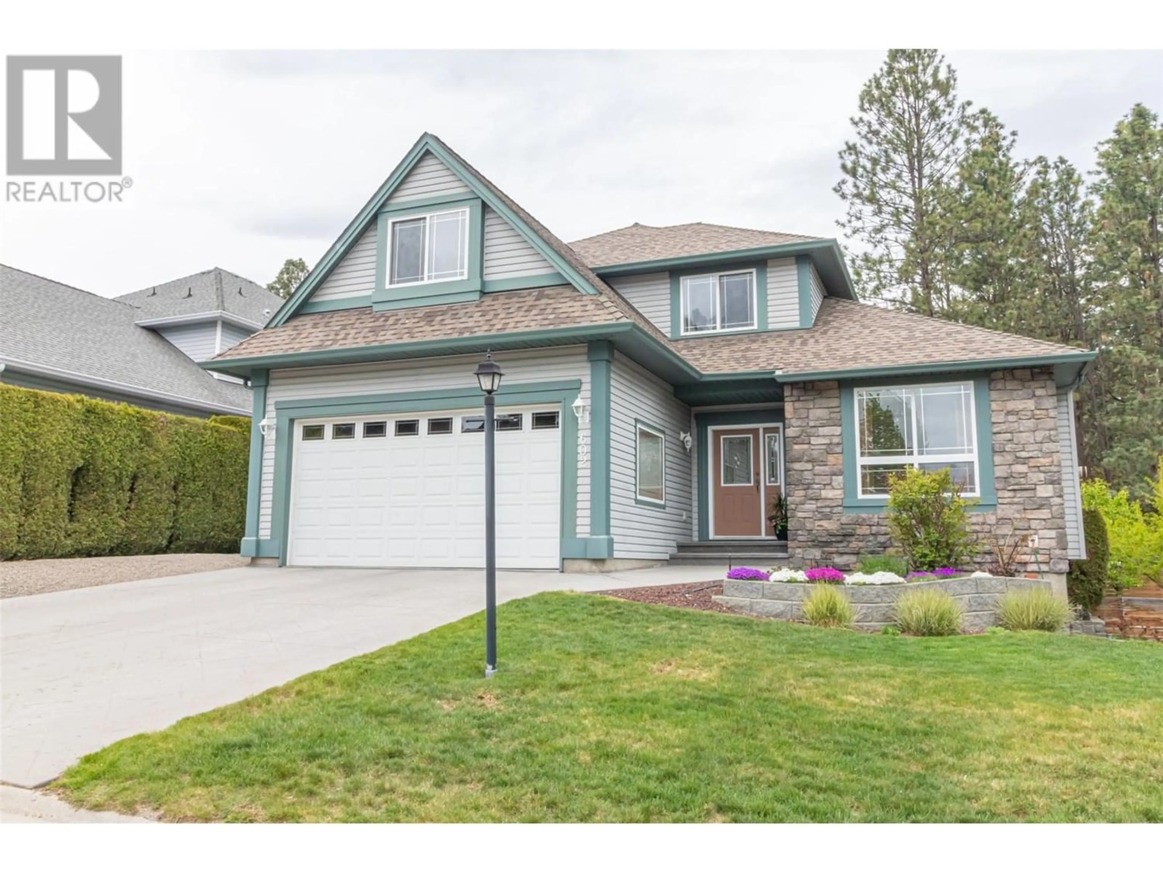 Frontside or backside of a home for 602 Spruceview Place, Kelowna British Columbia V1V2N2