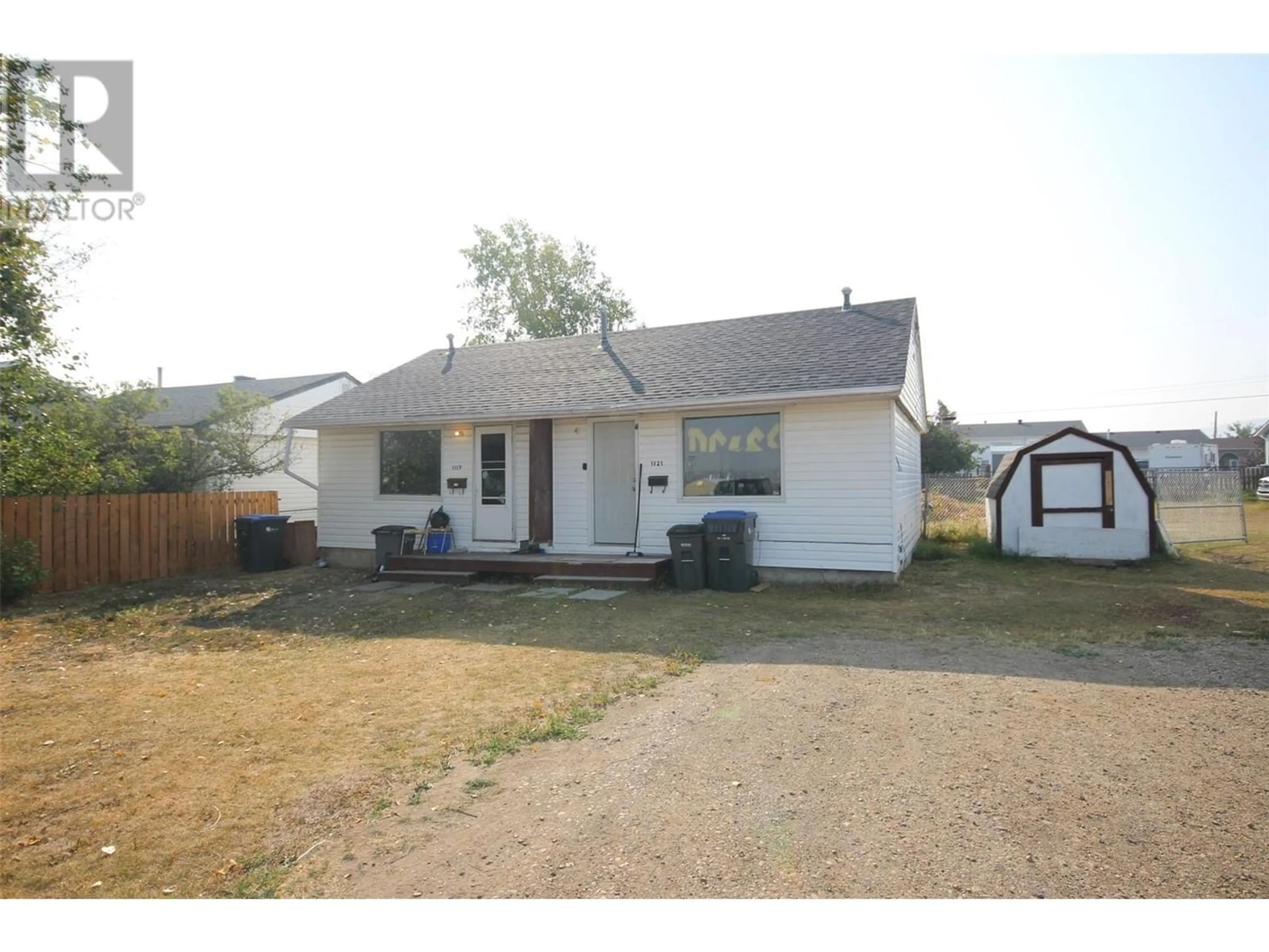 Frontside or backside of a home for 1121 116 Avenue, Dawson Creek British Columbia V1G3E5
