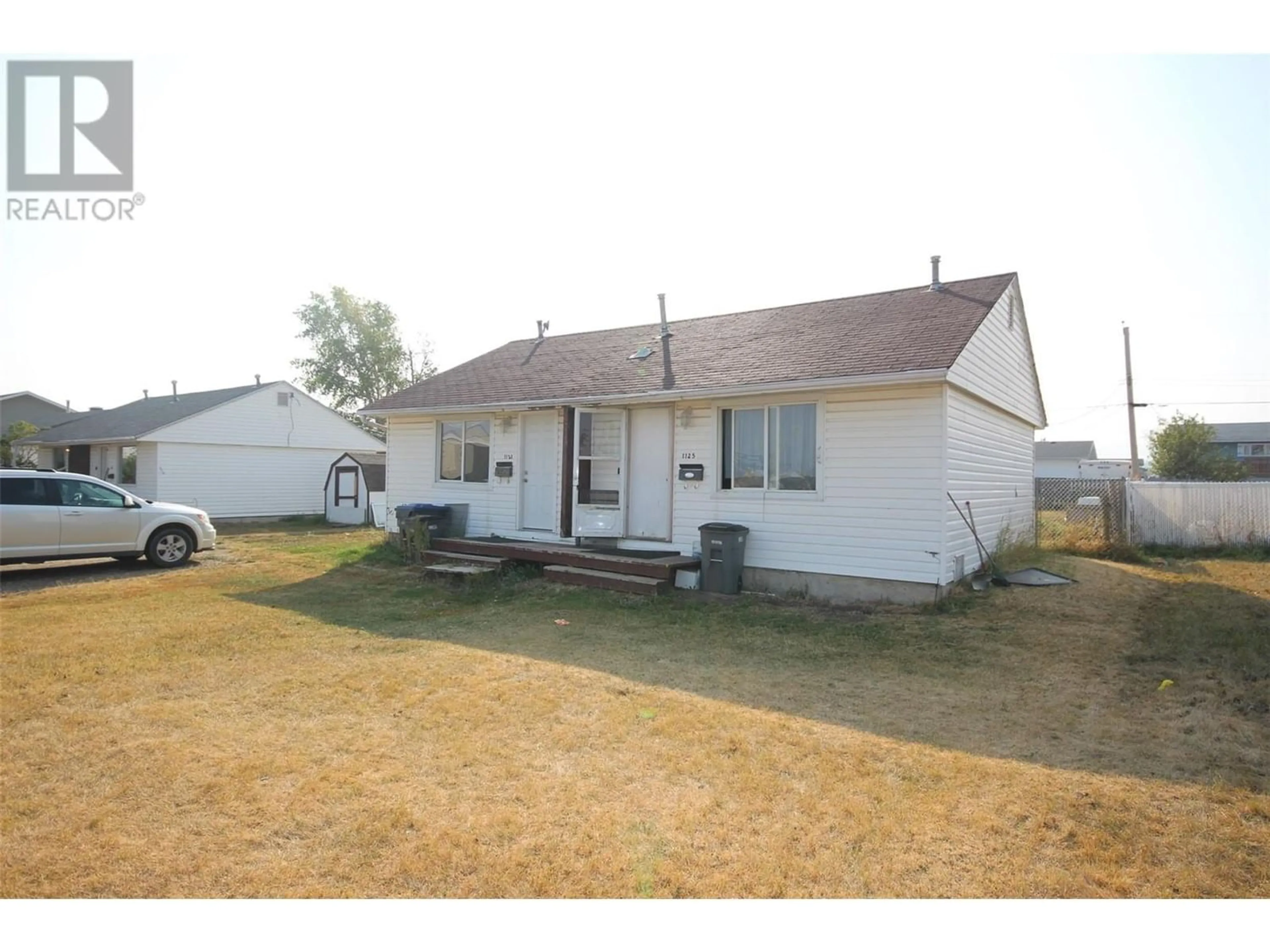Frontside or backside of a home for 1125 116 Avenue, Dawson Creek British Columbia V1G3E5