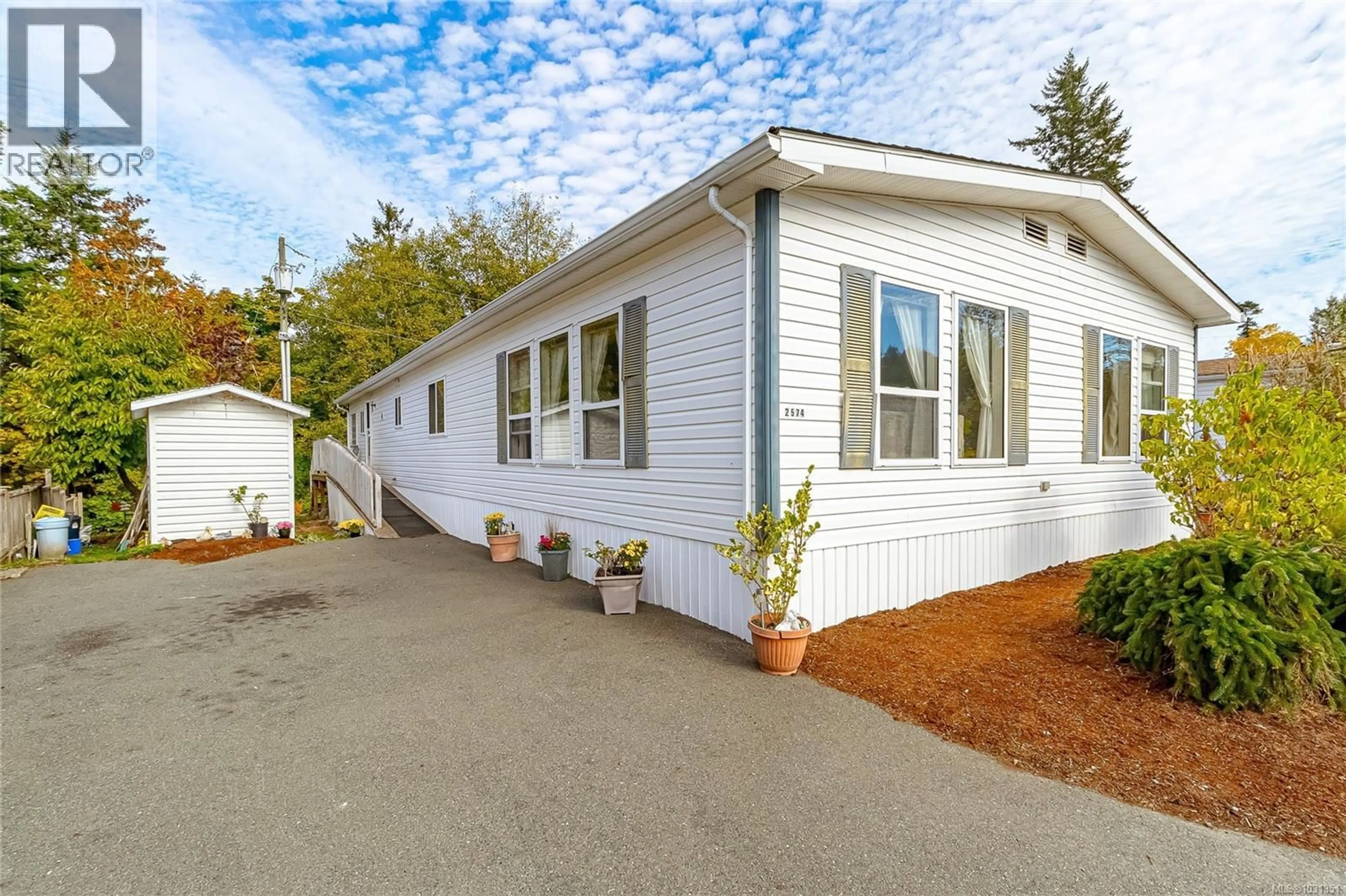 Home with vinyl exterior material, street for 2574 HERON WAY, Central Saanich British Columbia V8M2E1