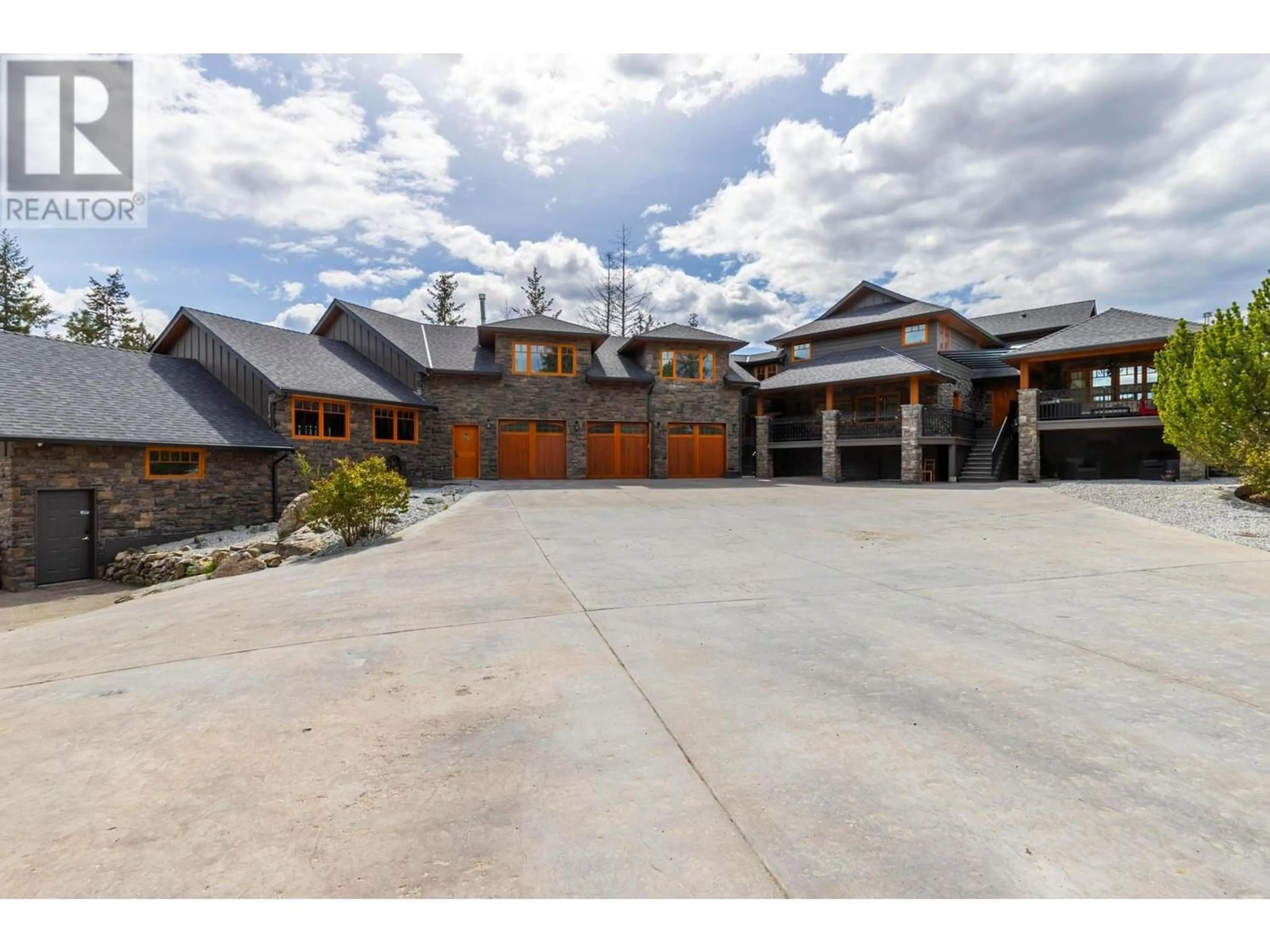 Frontside or backside of a home, the street view for 5774 Deadpine Drive, Kelowna British Columbia V1P1A3