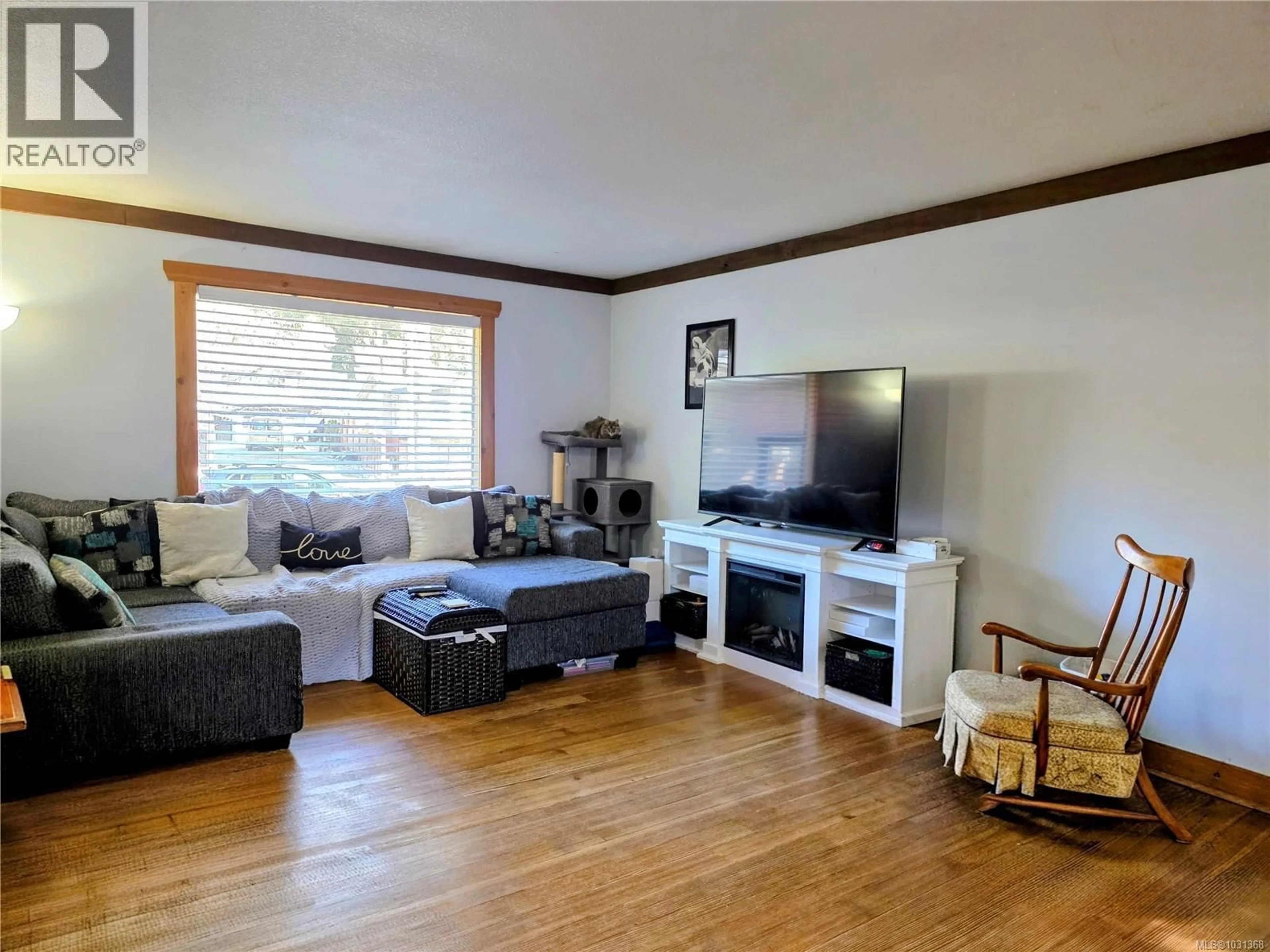 Living room with furniture, wood/laminate floor for 236 GRANTS LAKE ROAD, Lake Cowichan British Columbia V0R2G0