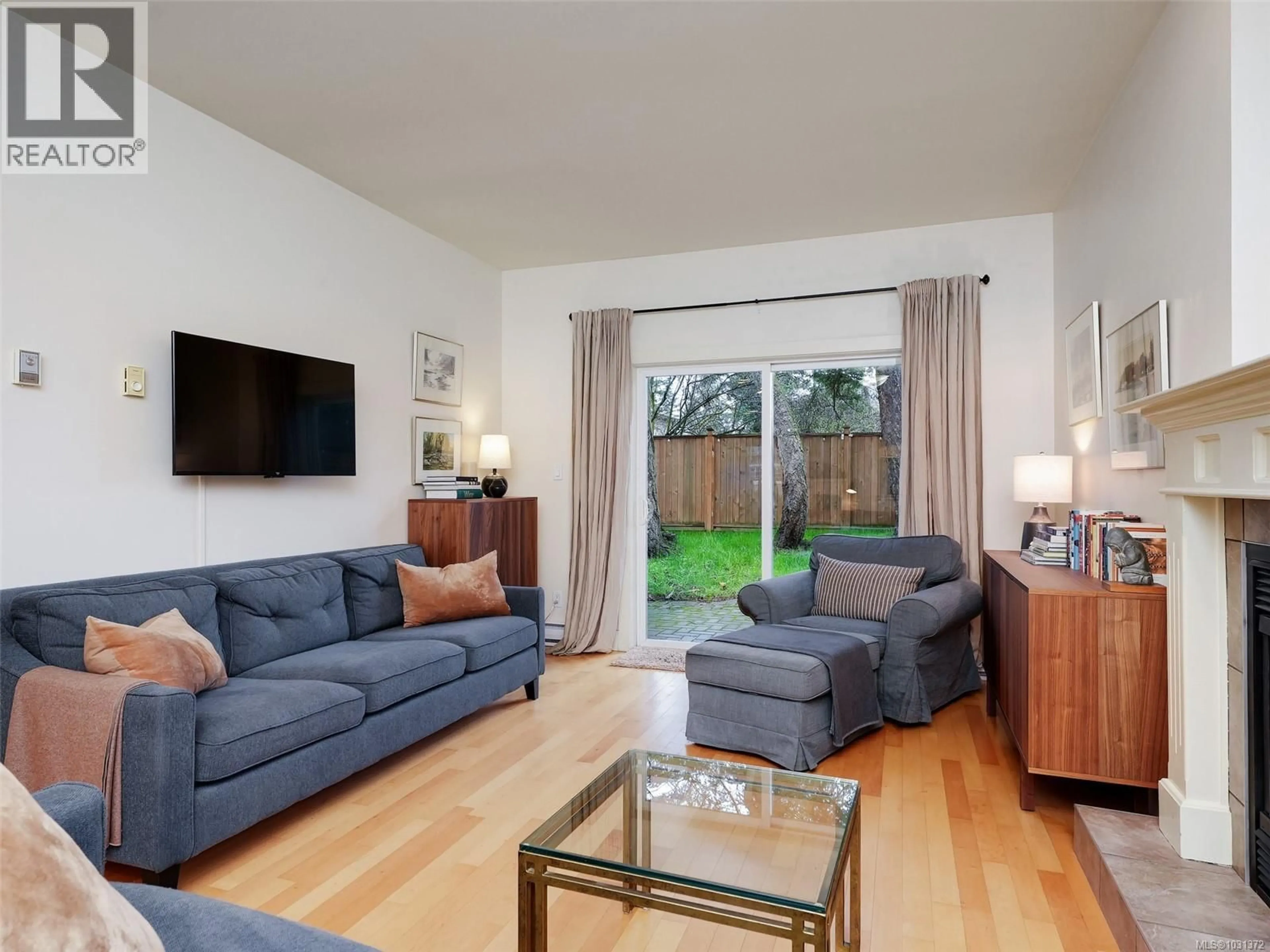 Living room with furniture, wood/laminate floor for 12 - 4530 PIPELINE ROAD, Saanich British Columbia V8Z7Y6