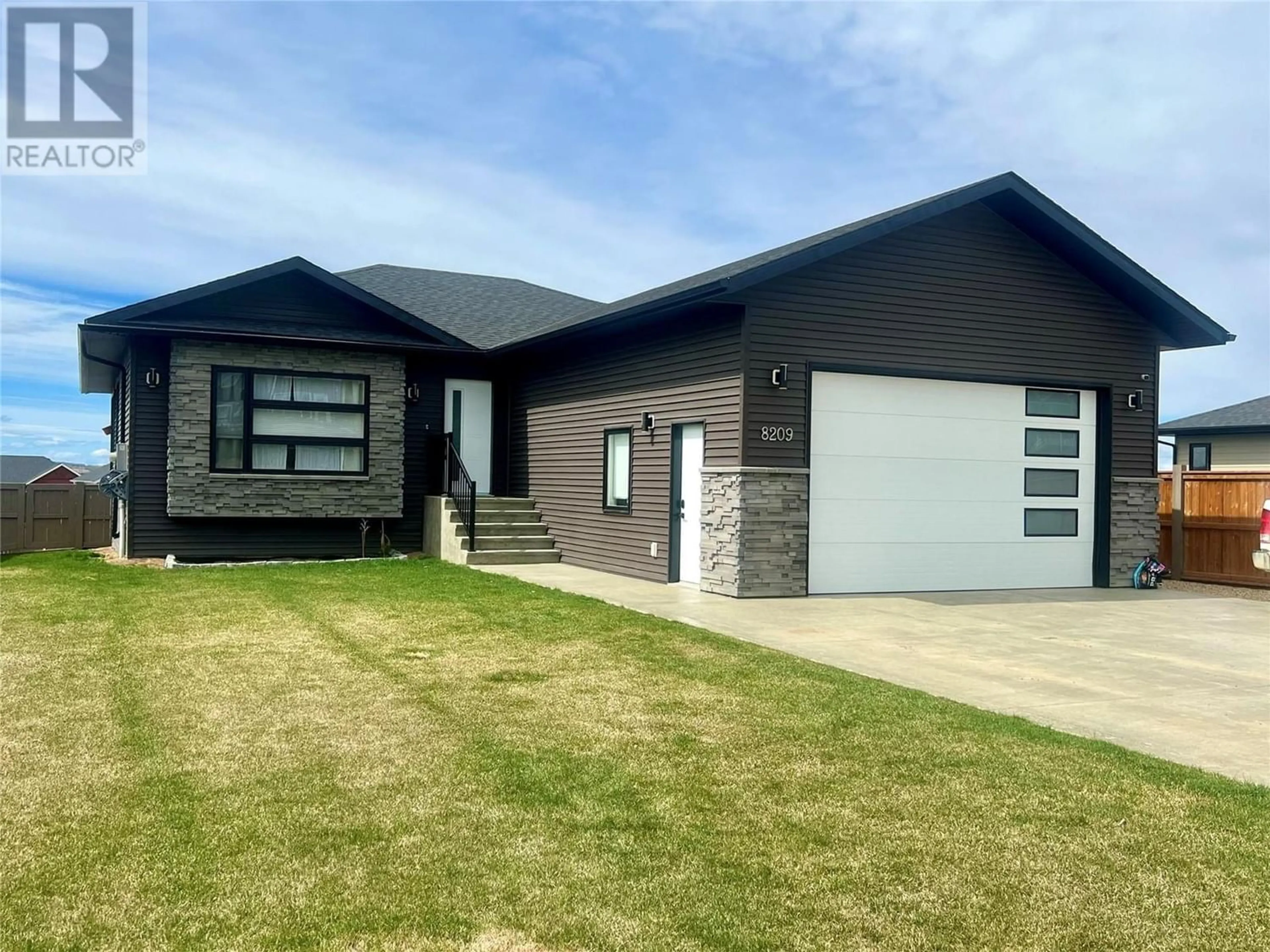 Frontside or backside of a home for 8209 18A Street, Dawson Creek British Columbia V1G0J5