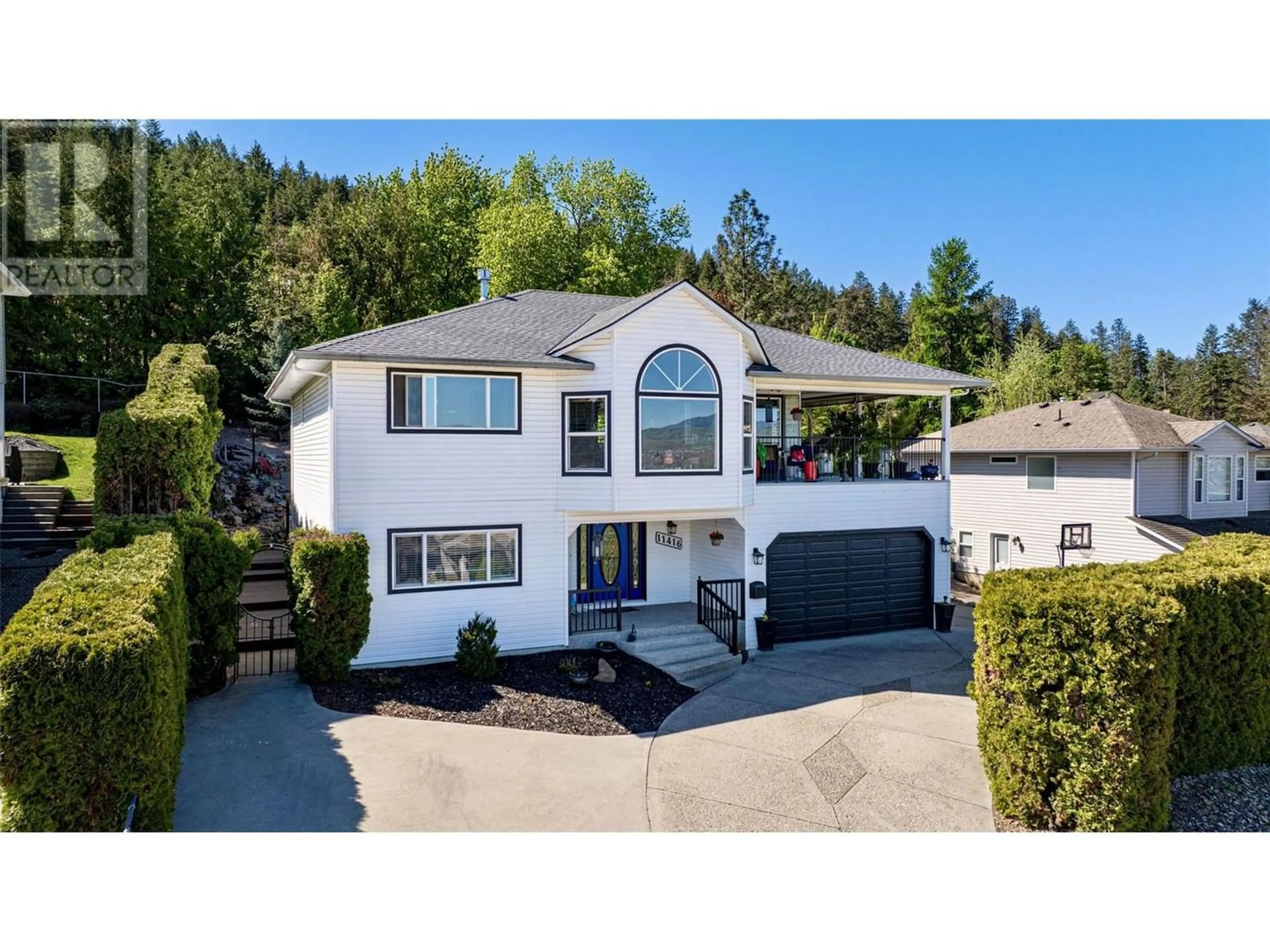 Frontside or backside of a home for 11416 Palfrey Drive E, Coldstream British Columbia V1B2B1
