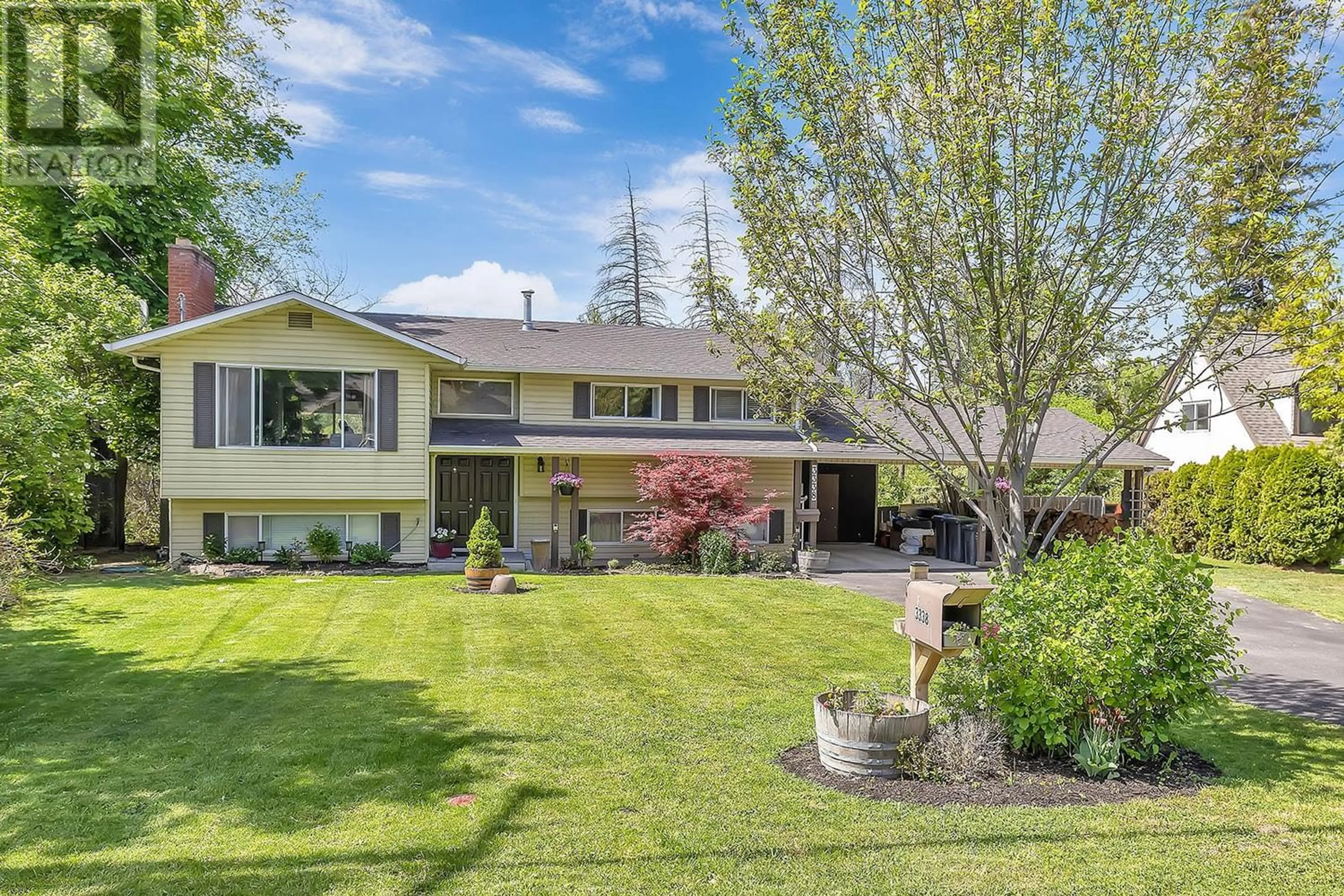 Frontside or backside of a home for 3338 Wildwood Road, Kelowna British Columbia V1W2S4
