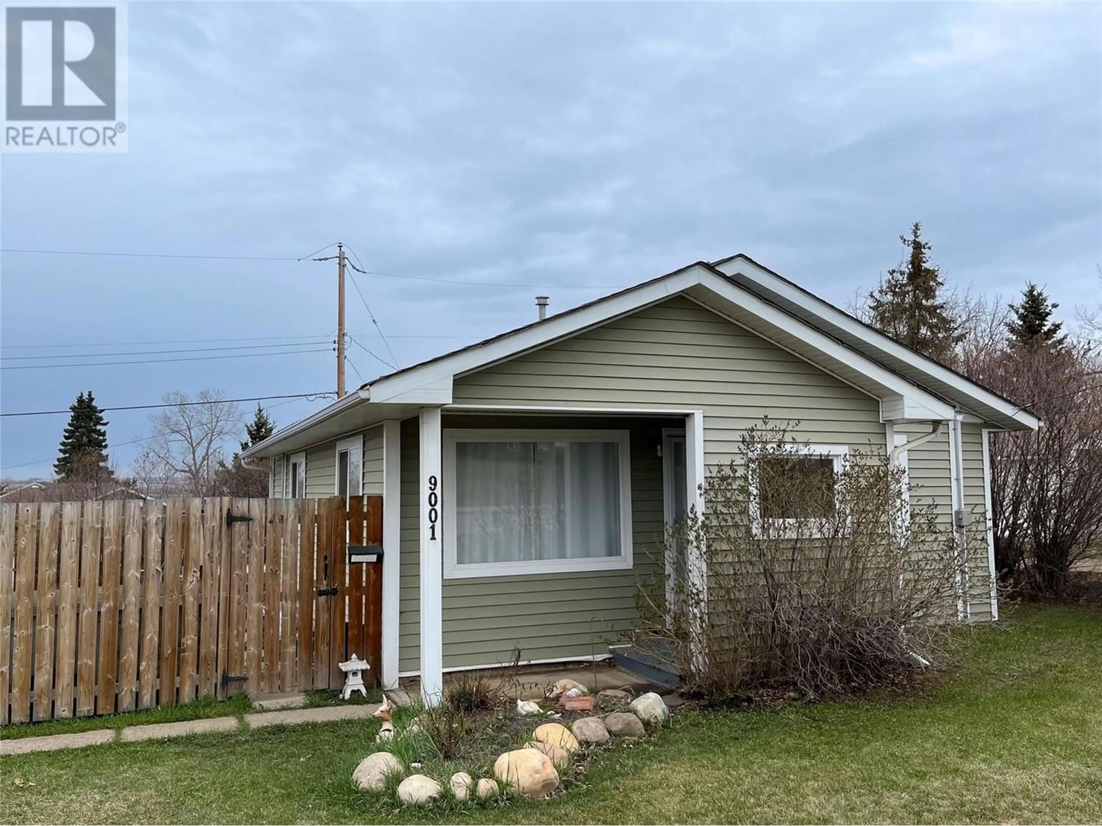 Frontside or backside of a home for 9001 17 Street, Dawson Creek British Columbia V1G4A5