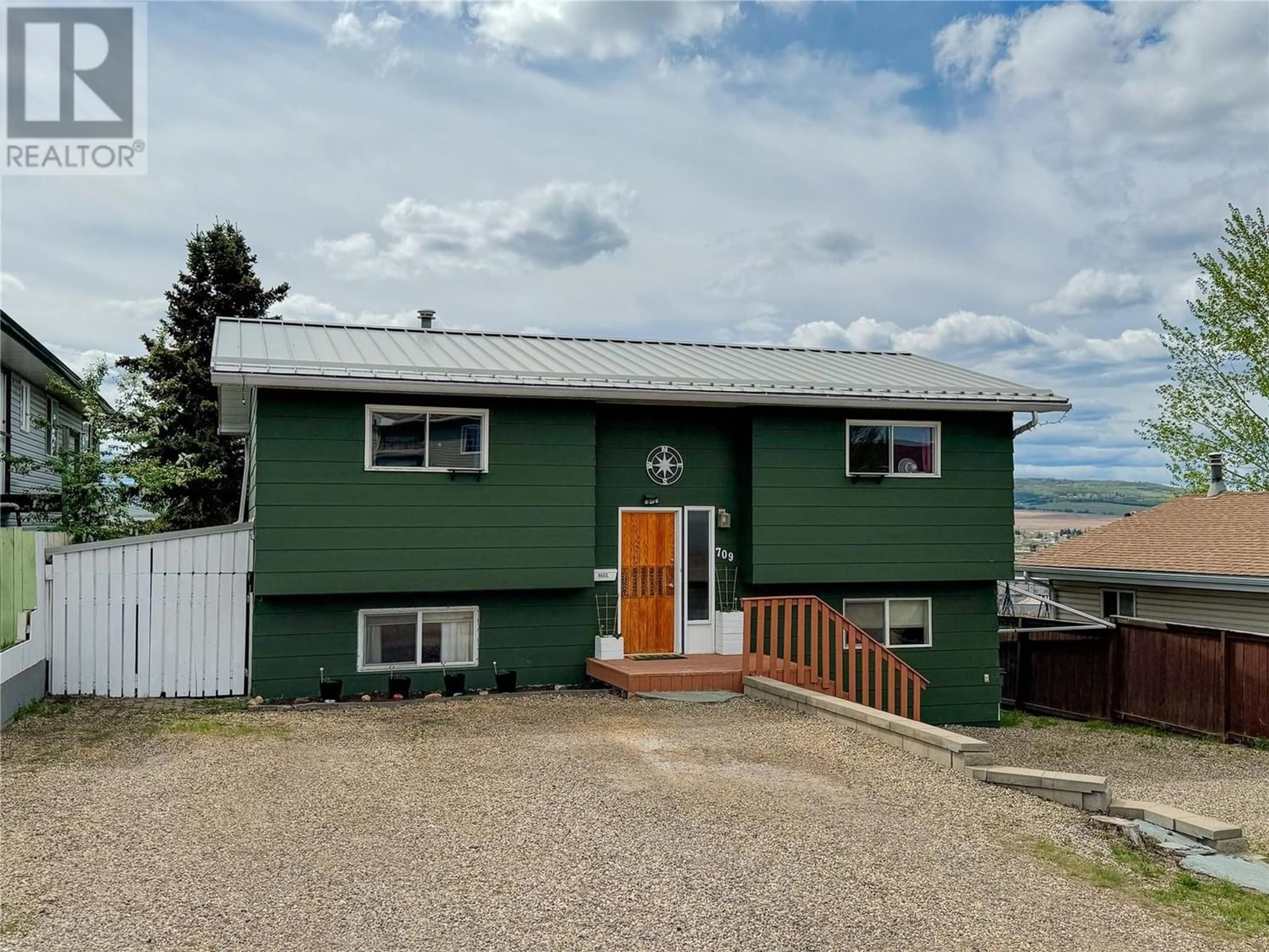 Frontside or backside of a home for 709 99 Avenue, Dawson Creek British Columbia V1G1T5