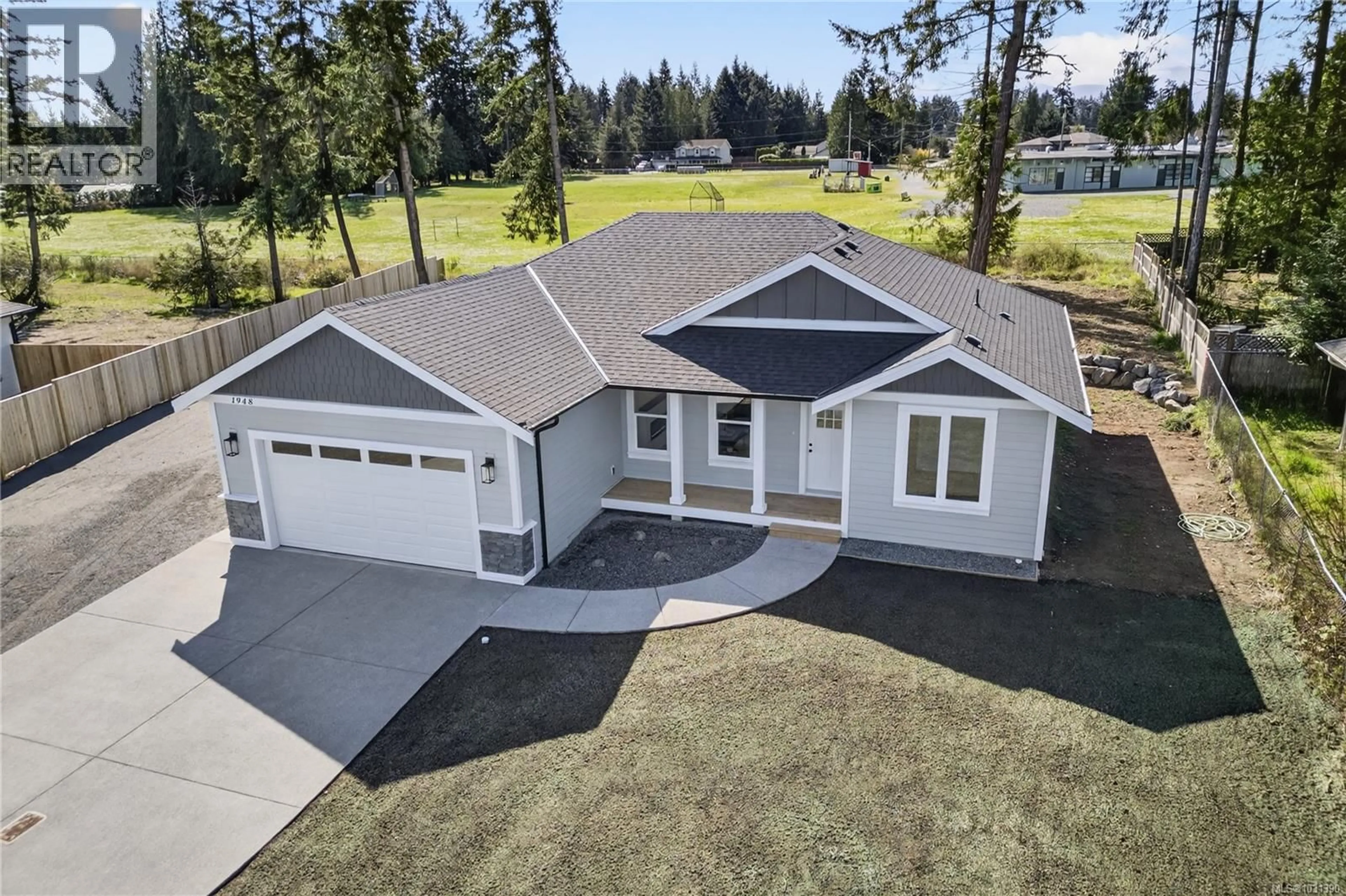 A pic from outside/outdoor area/front of a property/back of a property/a pic from drone, street for 1948 WOOBANK ROAD, Nanaimo British Columbia V9X1H4