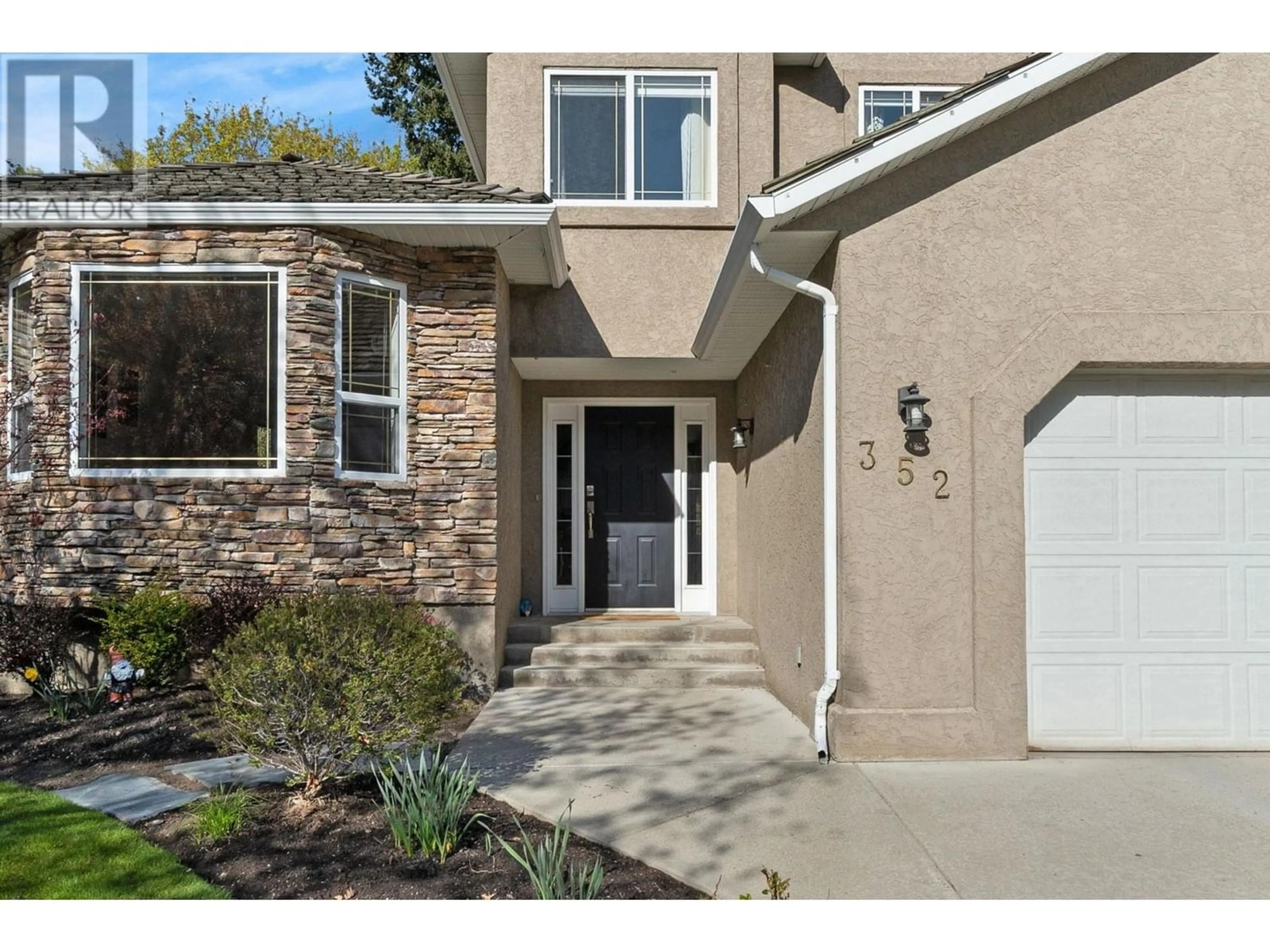 Frontside or backside of a home for 352 Rio Drive S, Kelowna British Columbia V1V2B1