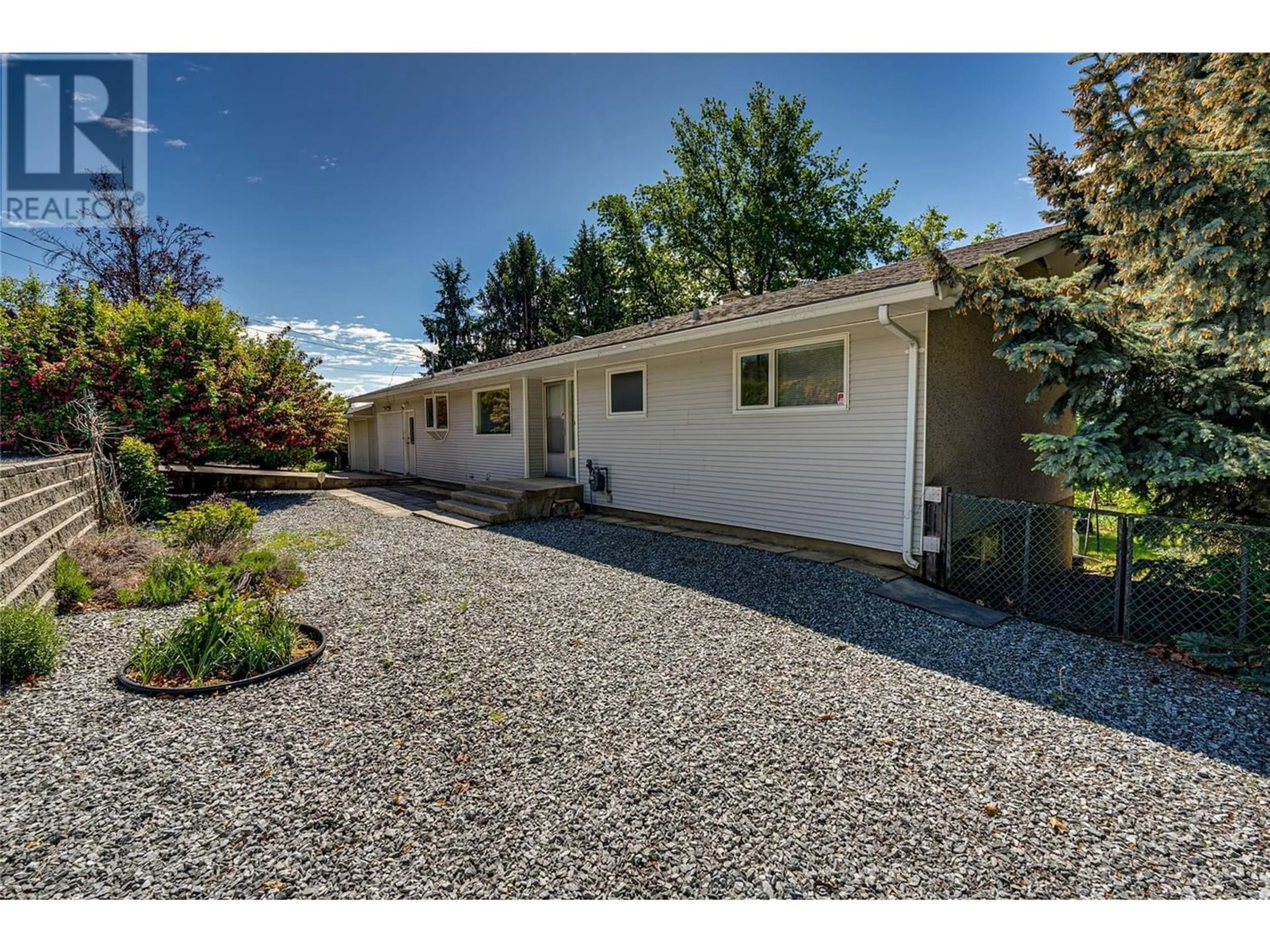 Home with vinyl exterior material for 5696 Bella Vista Road, Vernon British Columbia V1H1A2