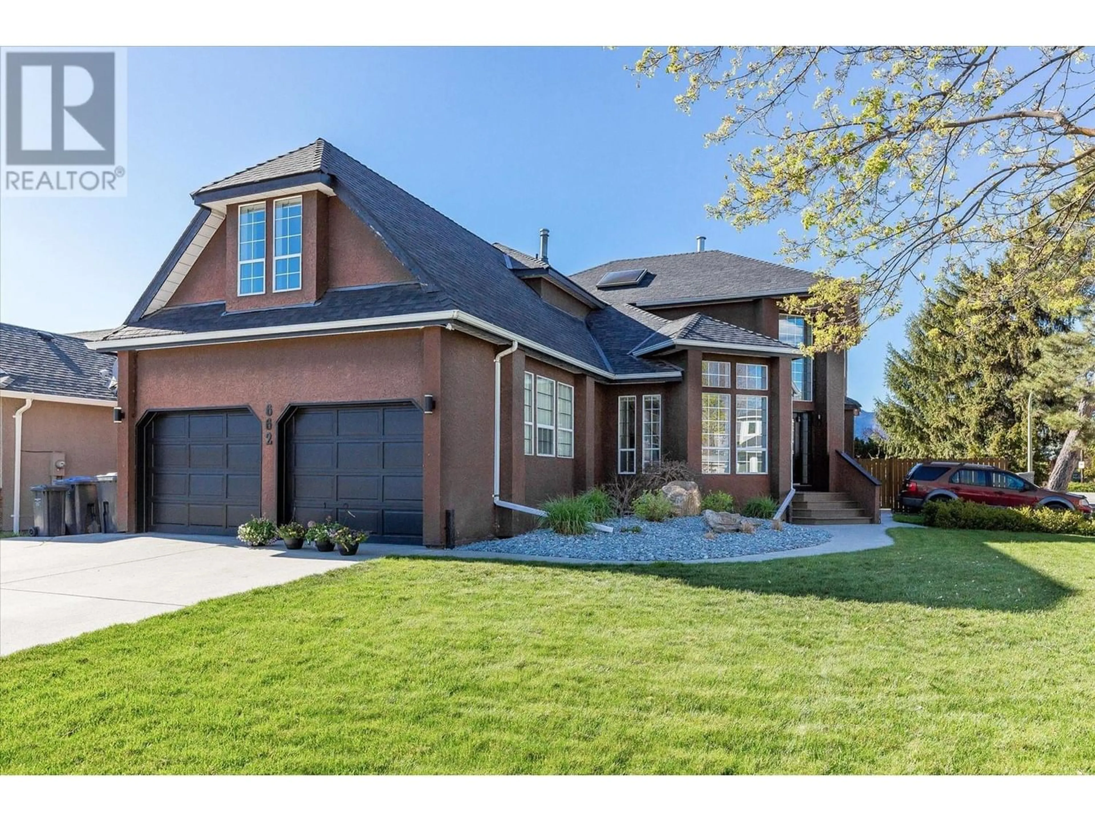 Home with brick exterior material for 662 Southwind Drive, Kelowna British Columbia V1W8G1