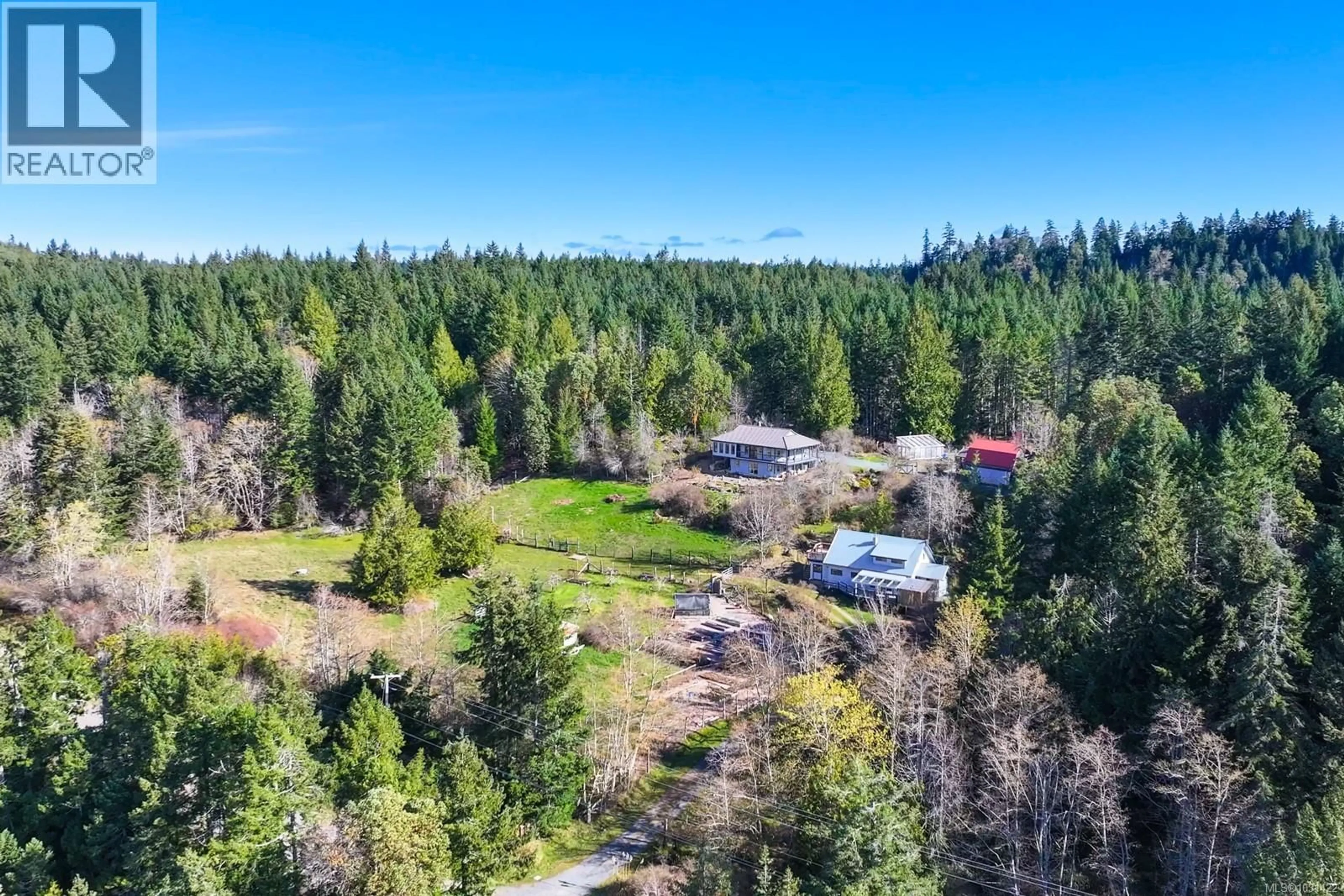 A pic from outside/outdoor area/front of a property/back of a property/a pic from drone, forest/trees view for 3800 LACON ROAD, Denman Island British Columbia V0R1T0
