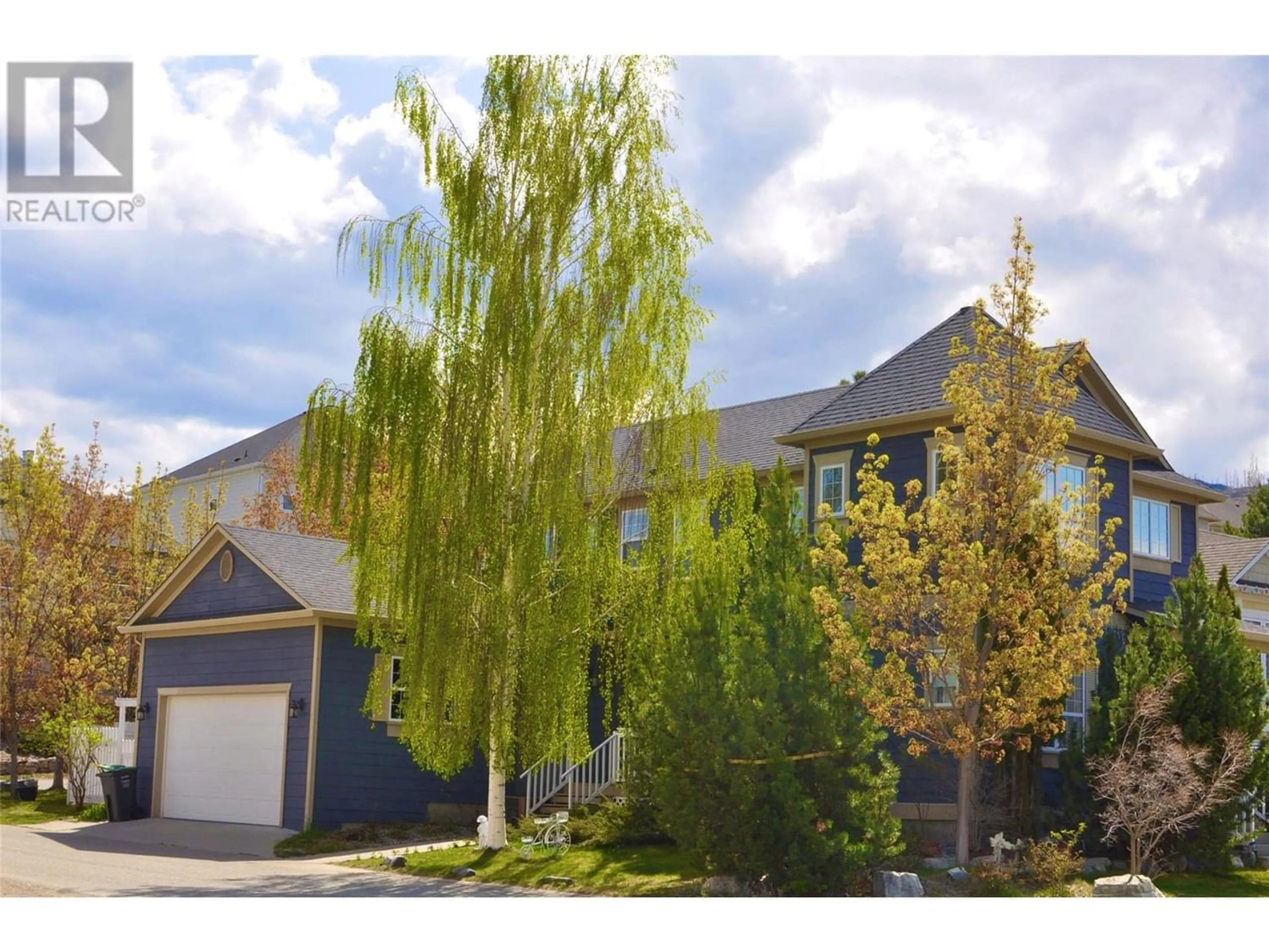 Frontside or backside of a home for 393 McCarren Avenue, Kelowna British Columbia V1W4W3