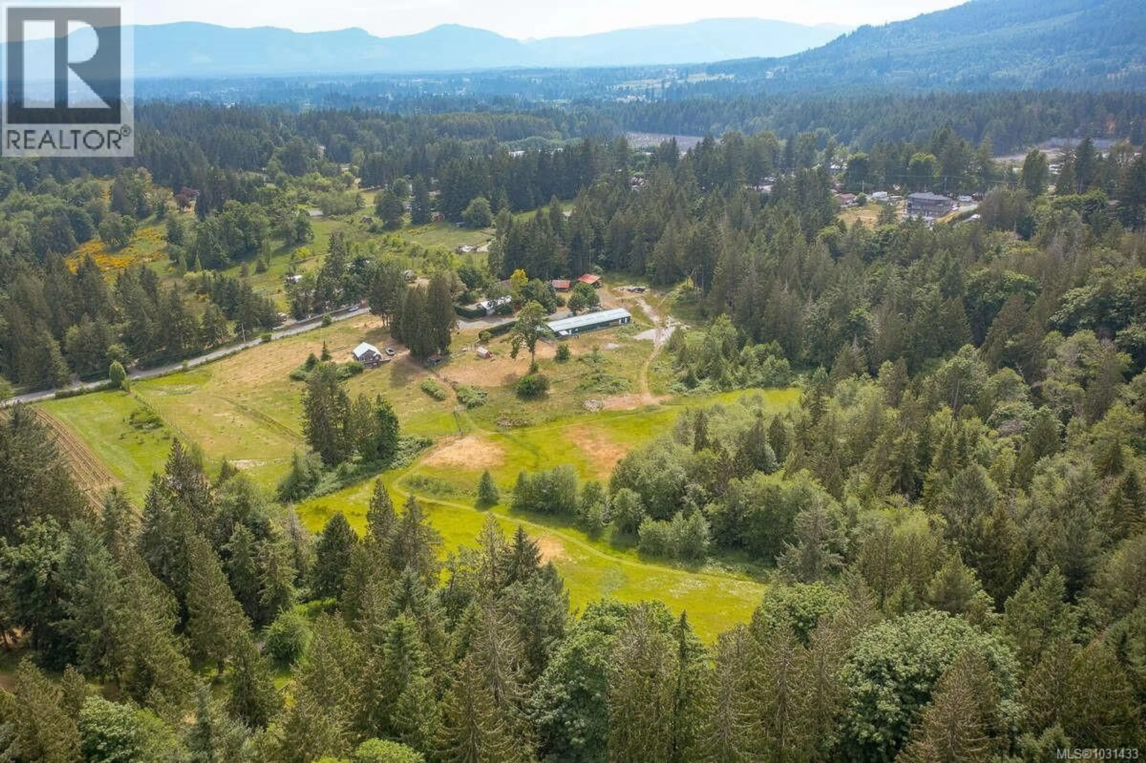 A pic from outside/outdoor area/front of a property/back of a property/a pic from drone, forest/trees view for 7661 MAYS ROAD, Duncan British Columbia V9L6A8