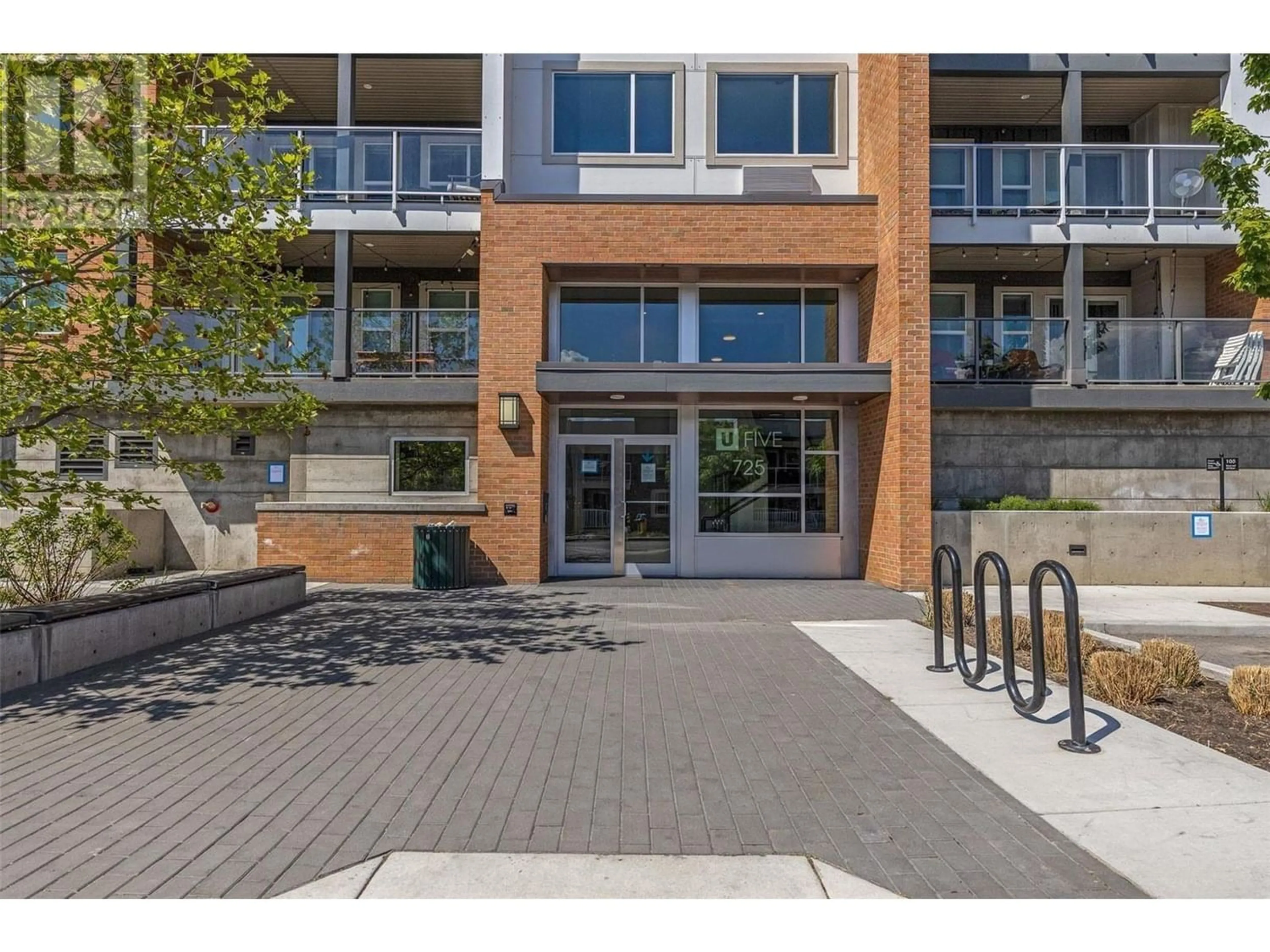 A pic from exterior of the house or condo for 725 Academy Way Unit# 102, Kelowna British Columbia V1V0B4