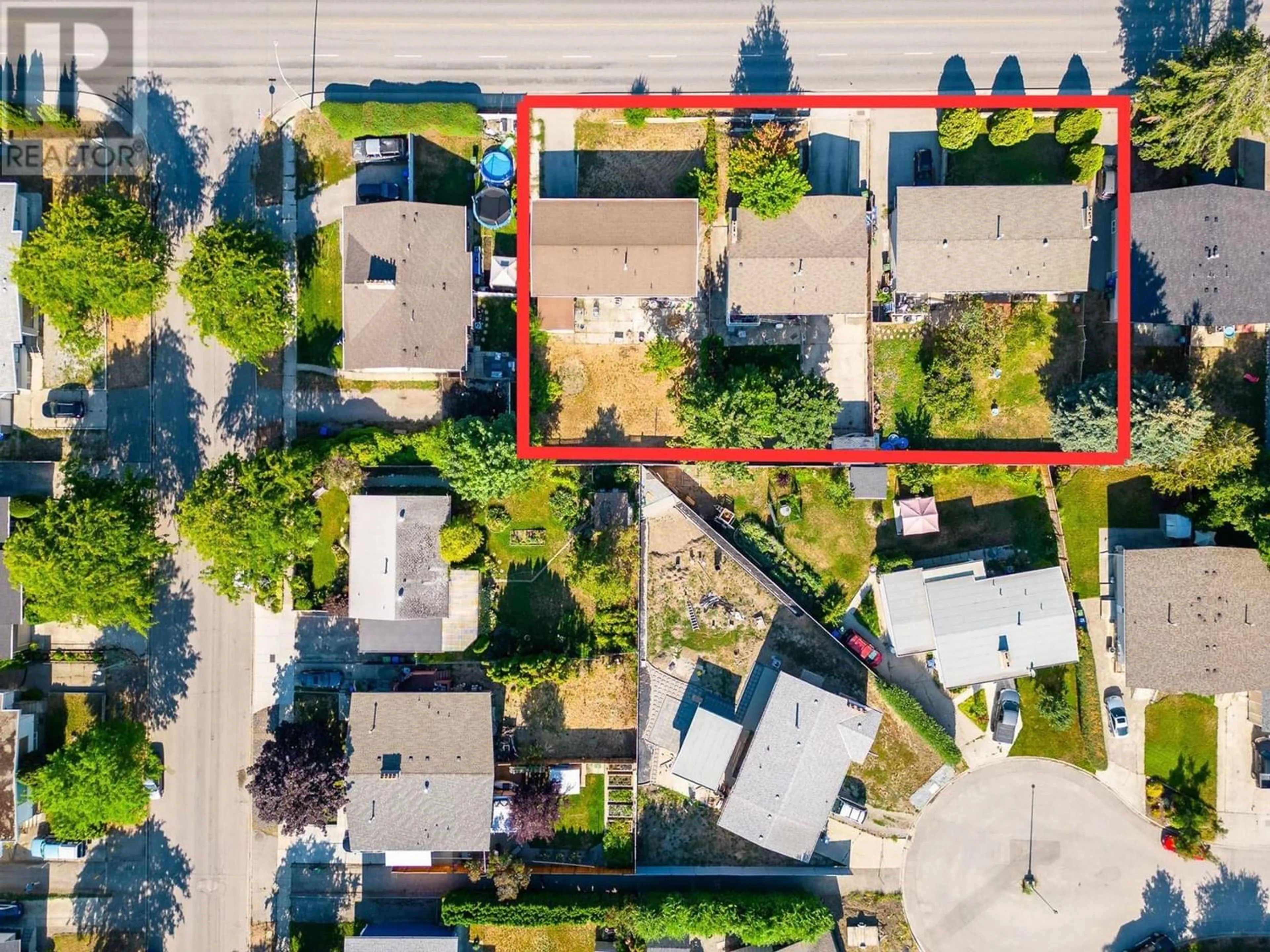 Frontside or backside of a home, the street view for 1395 Gordon Drive, Kelowna British Columbia V1Y3E9