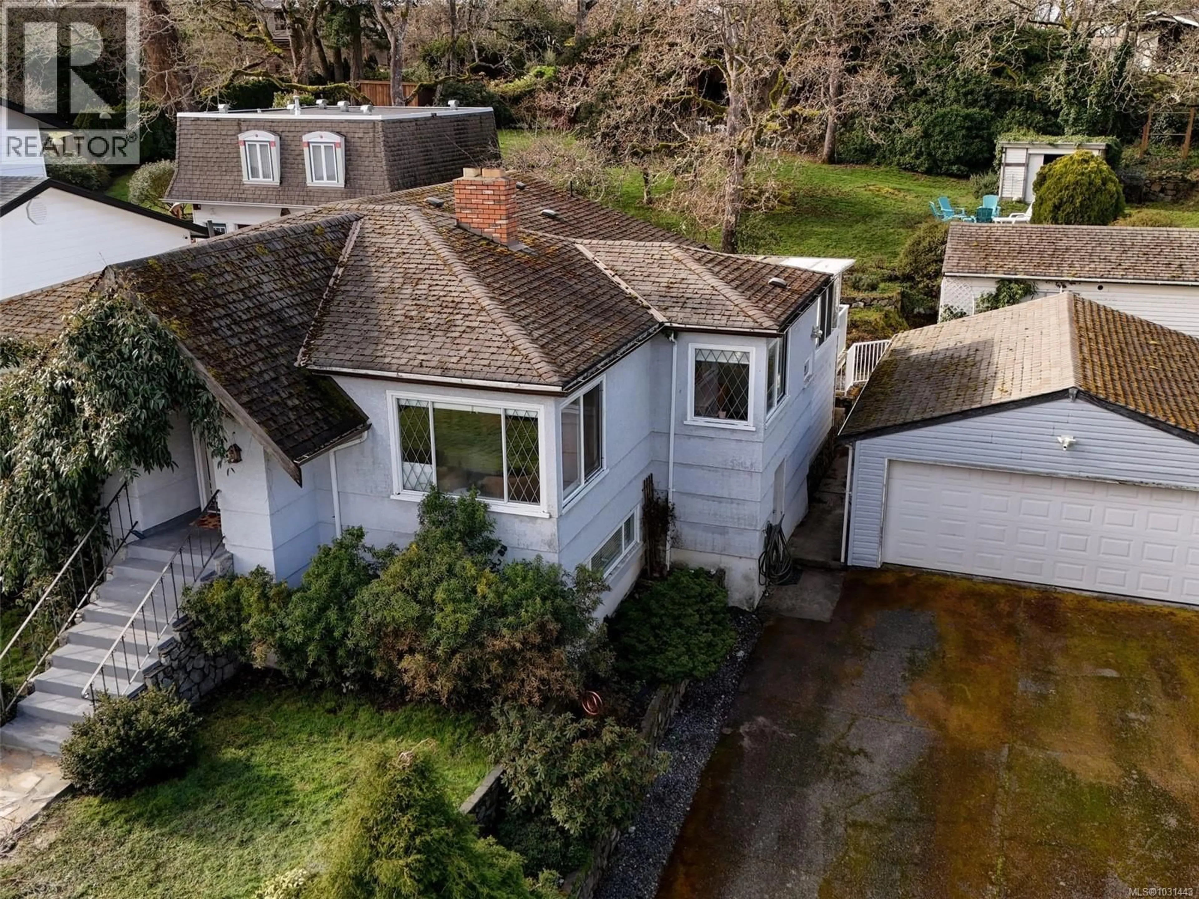 A pic from outside/outdoor area/front of a property/back of a property/a pic from drone, street for 3900 ASCOT DRIVE, Saanich British Columbia V8P3S1