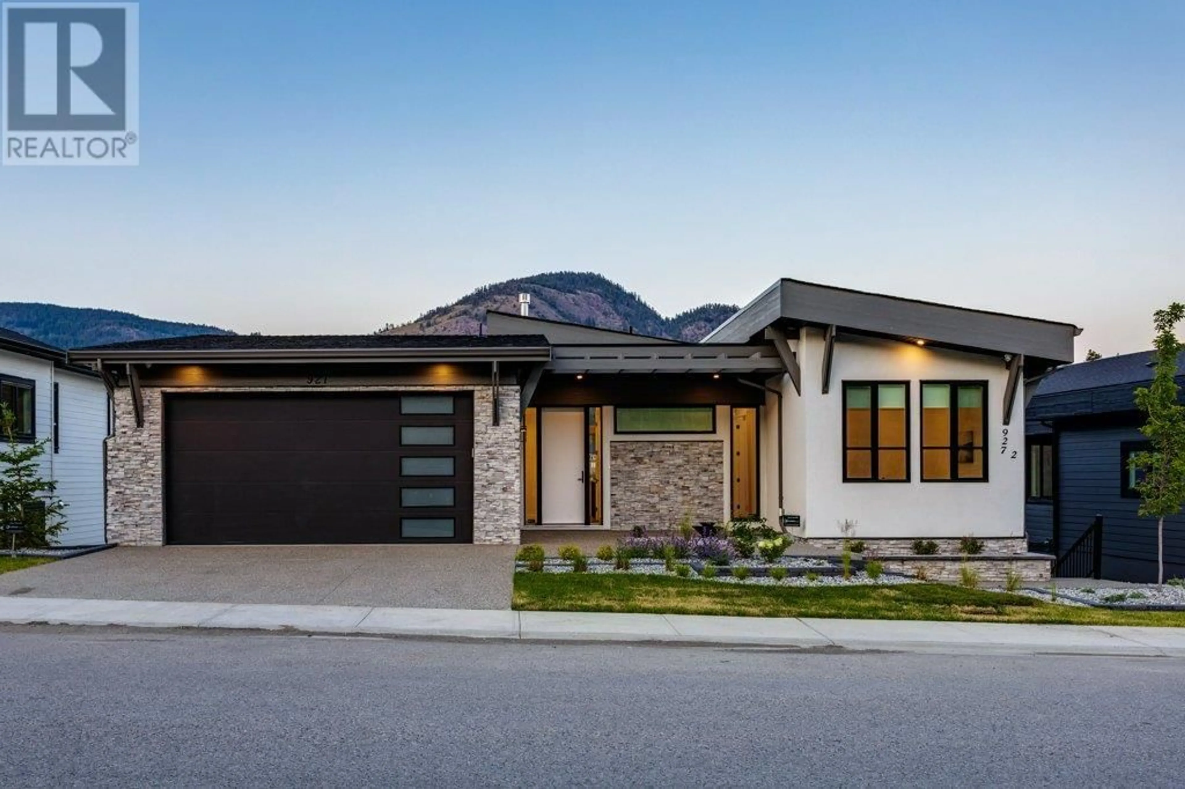 Home with brick exterior material for 927 Carnoustie Drive, Kelowna British Columbia V1P0A3